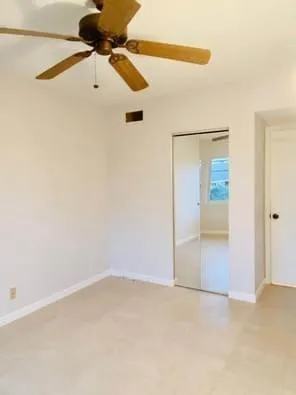 an empty room with fan