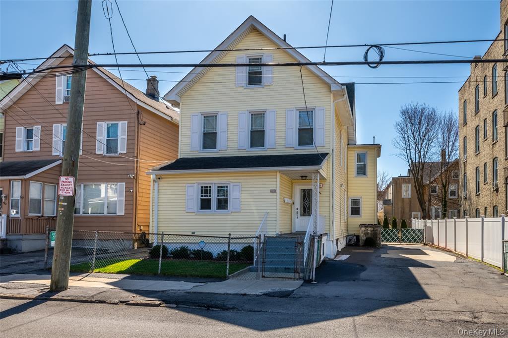 92 Washington Avenue, Unit 1 New Rochelle, NY 10801 - Photo 1 of 24 View of front of property featuring a gate and a fenced front yard