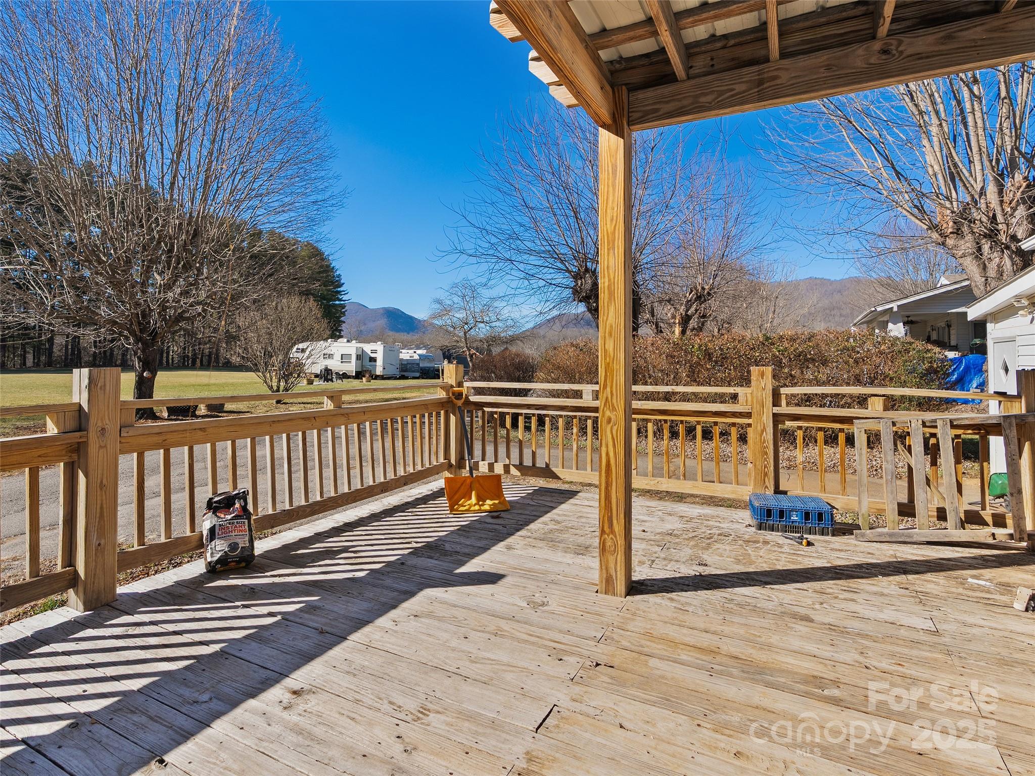 36 Lambert Lane Canton, NC 28716 - Photo 3 of 15 a view of a balcony with wooden floor and fence