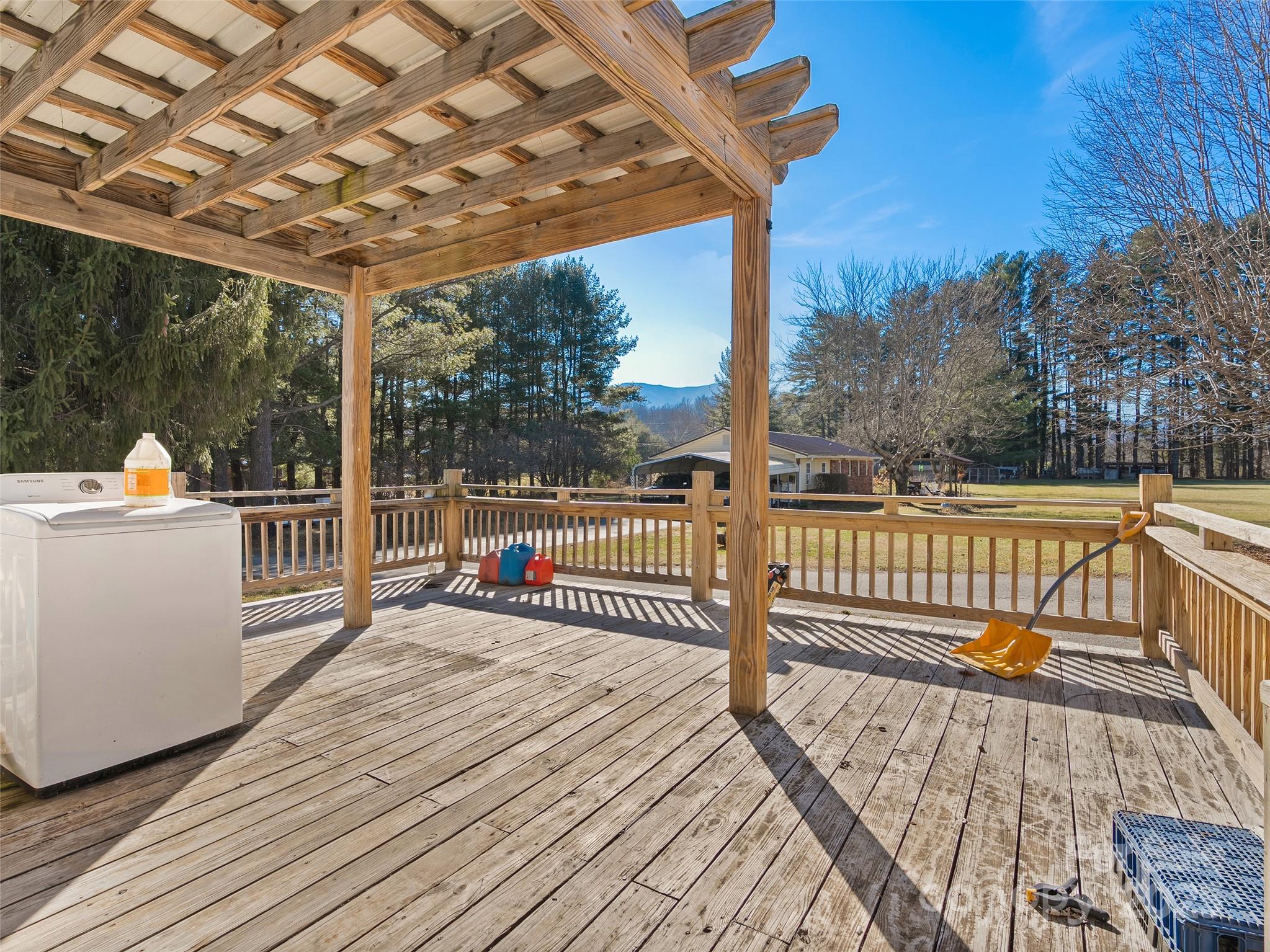36 Lambert Lane Canton, NC 28716 - Photo 4 of 15 a view of a deck with wooden floor and fence next to a yard