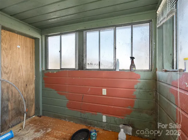 a room with a bed and a window