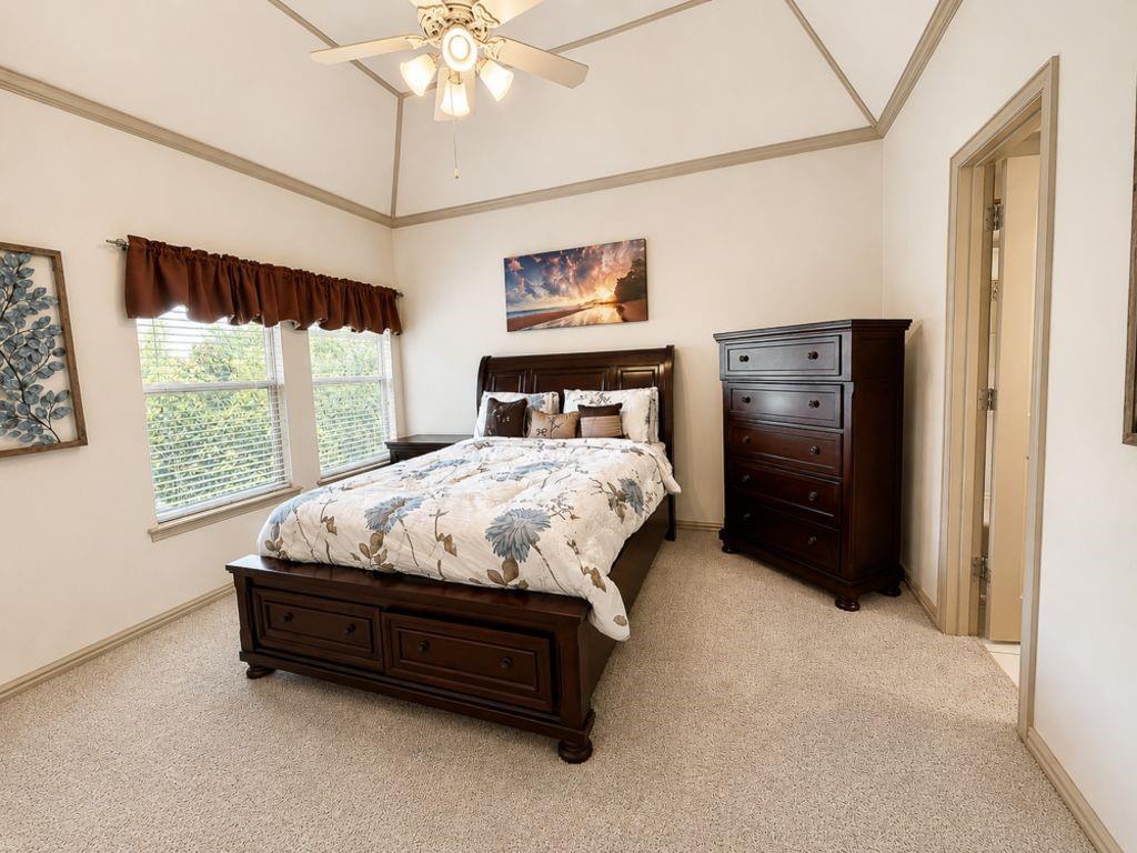 7005 Peter's Path Colleyville, TX 76034 - Photo 29 of 40 a bed sitting in a bedroom next to a window