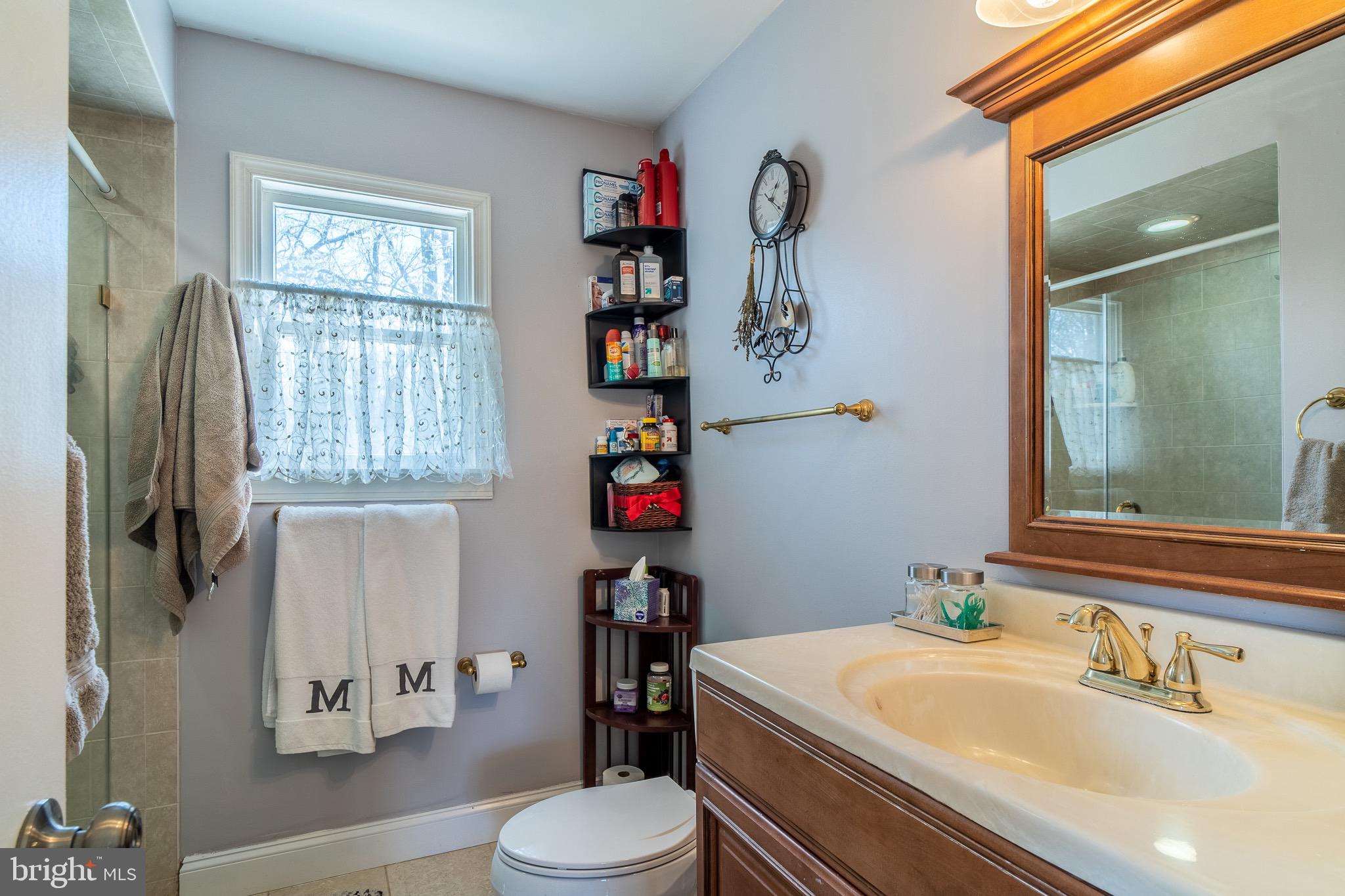 8605 Stonewall Road Manassas, VA 20110 - Photo 23 of 42 Sleek primary bath with modern shower, indulge