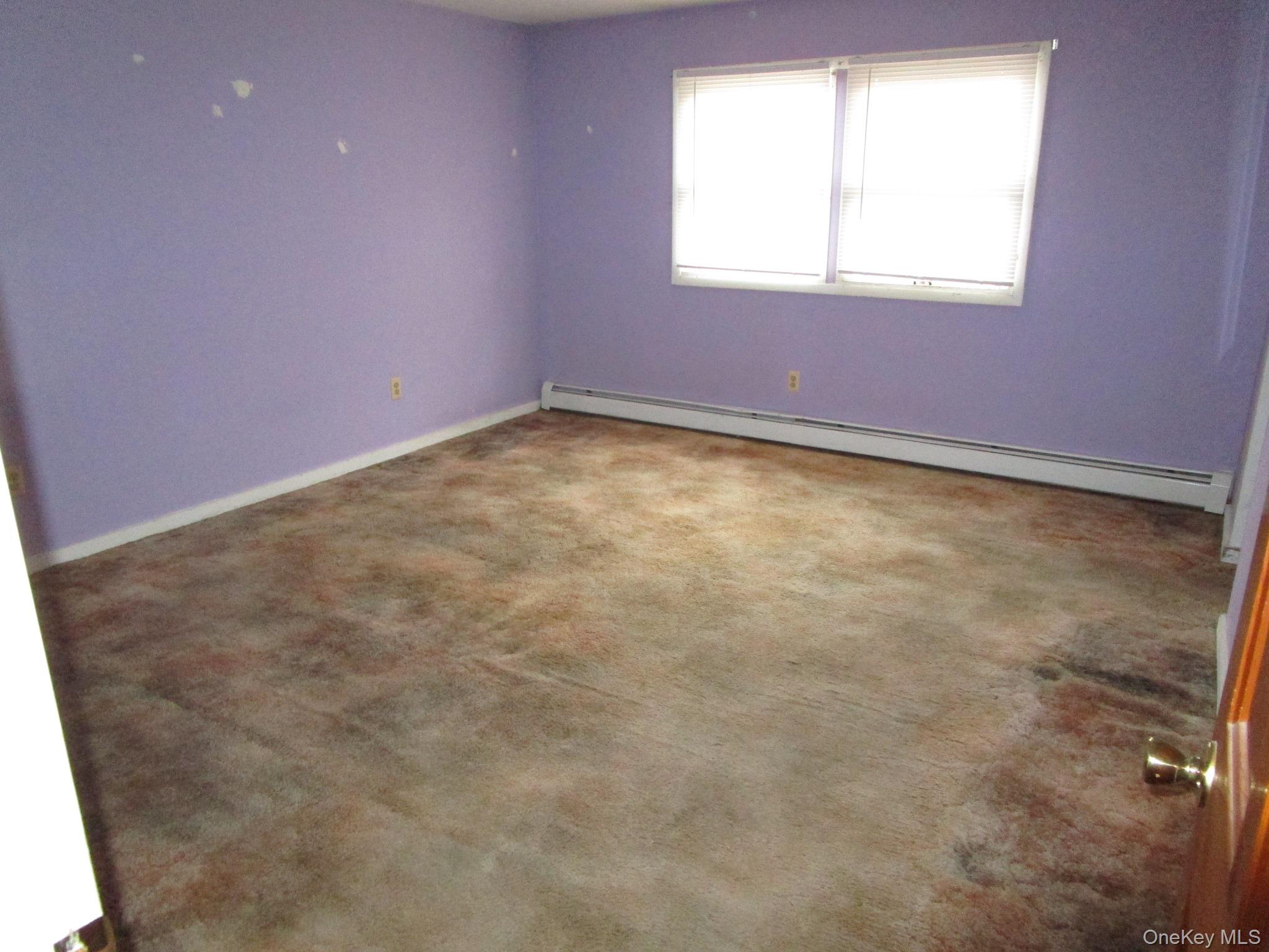 69 County Rte 93 New Hampton, NY 10958 - Photo 11 of 25 an empty room with a window