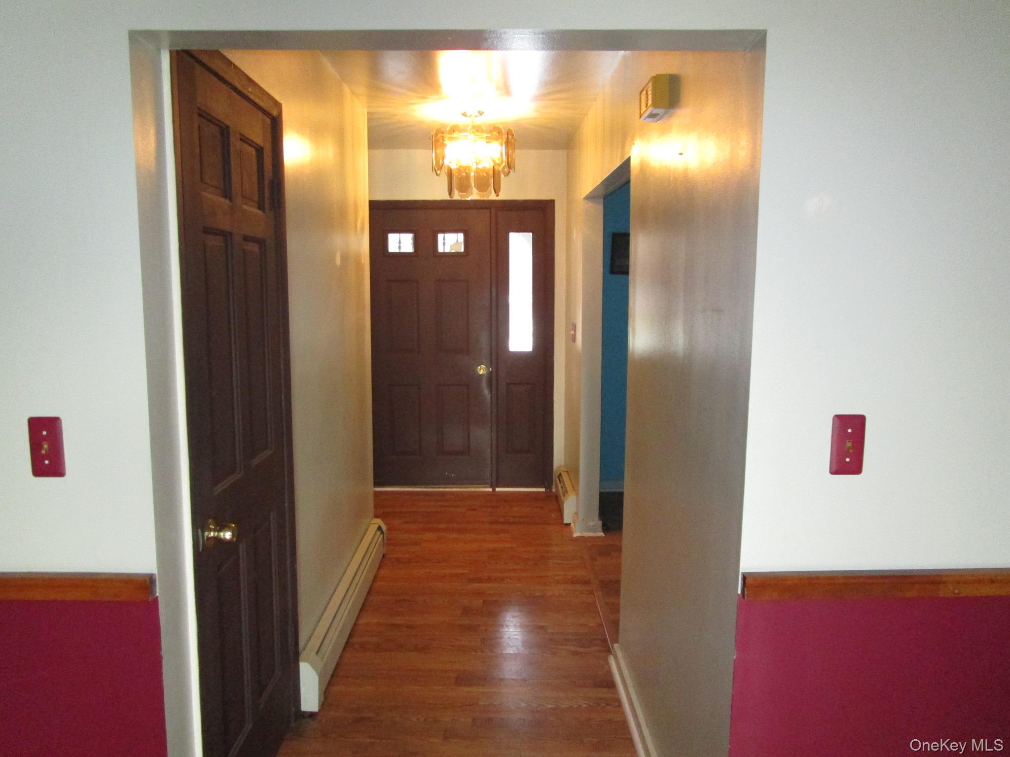 69 County Rte 93 New Hampton, NY 10958 - Photo 2 of 25 a view of hallway with a large mirror next to a window