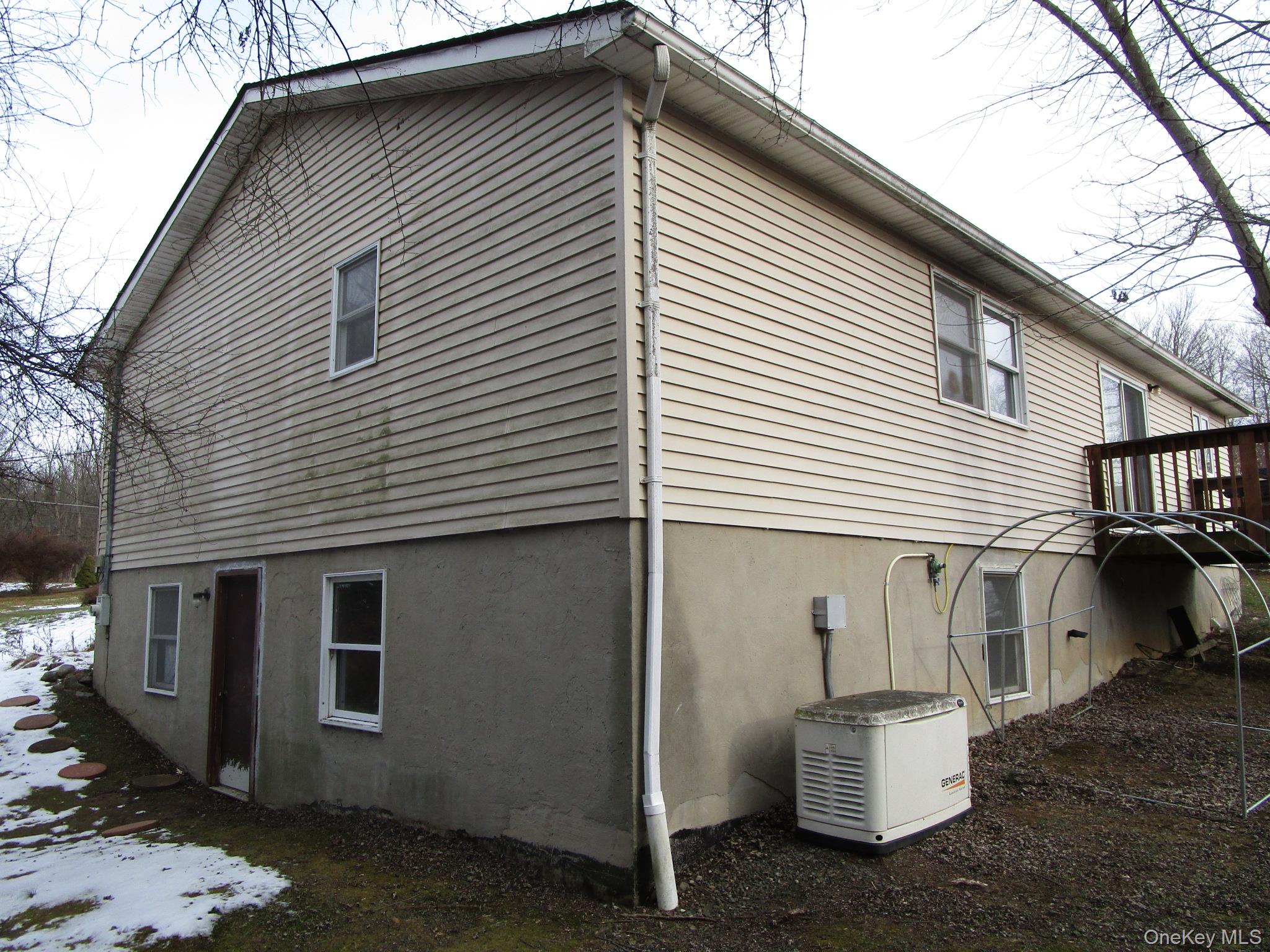 69 County Rte 93 New Hampton, NY 10958 - Photo 25 of 25 a view of a white house with many windows
