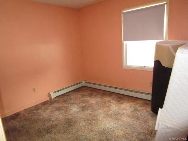 a white toilet sitting next to a bath tub