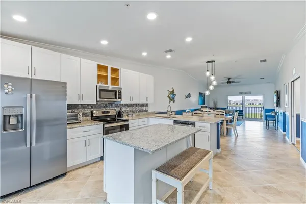 a kitchen with lots of counter top space and appliances