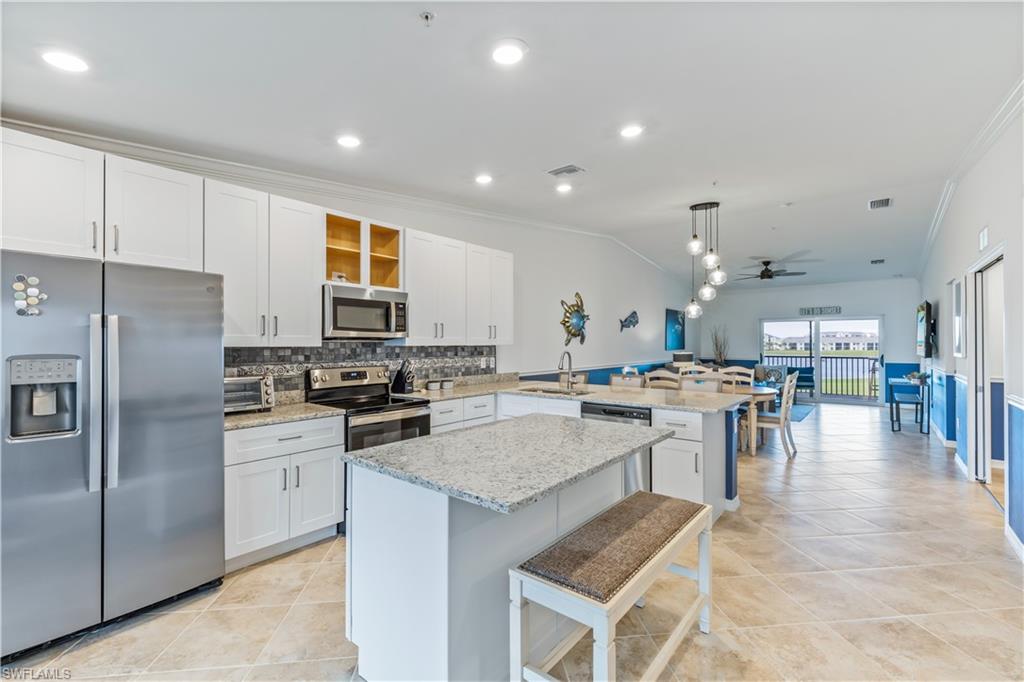 15990 Grassland Lane, Unit 3025 Babcock Ranch, FL 33982 - Photo 14 of 14 a kitchen with lots of counter top space and appliances
