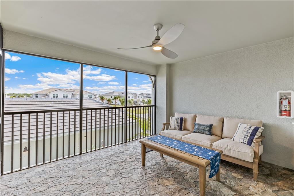 15990 Grassland Lane, Unit 3025 Babcock Ranch, FL 33982 - Photo 2 of 14 a living room with furniture and a floor to ceiling window