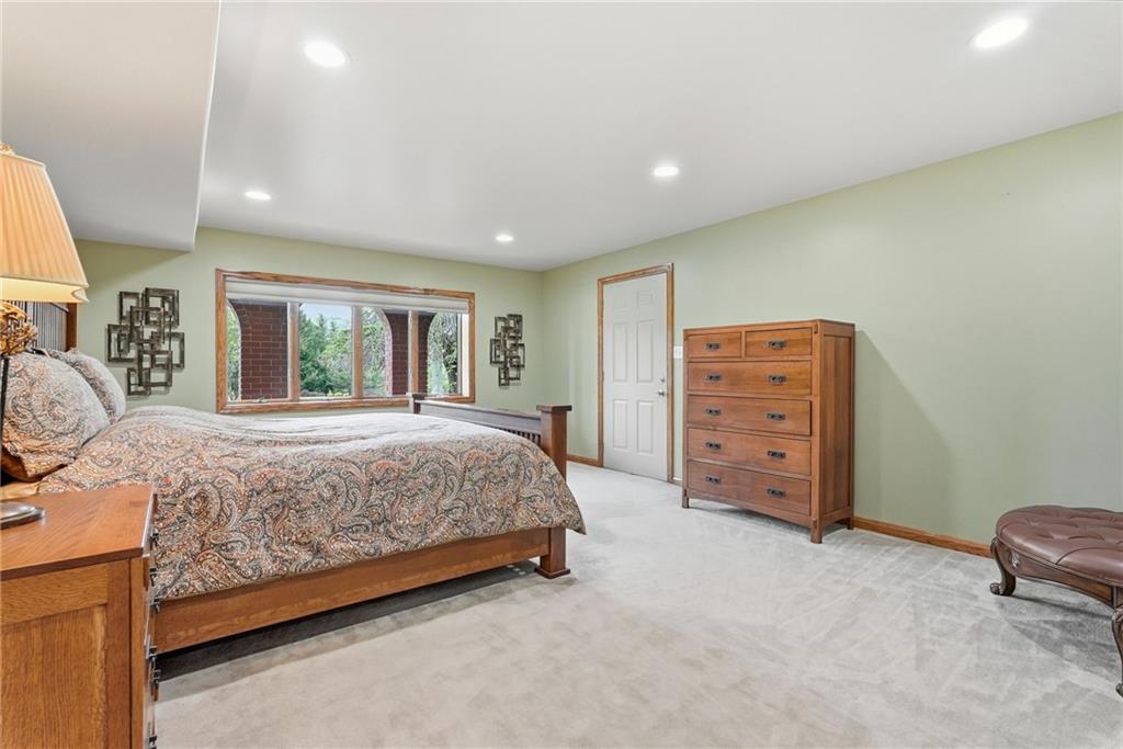 265 McFann Road Valencia, PA 16059 - Photo 36 of 50 a spacious bedroom with a bed and a couch