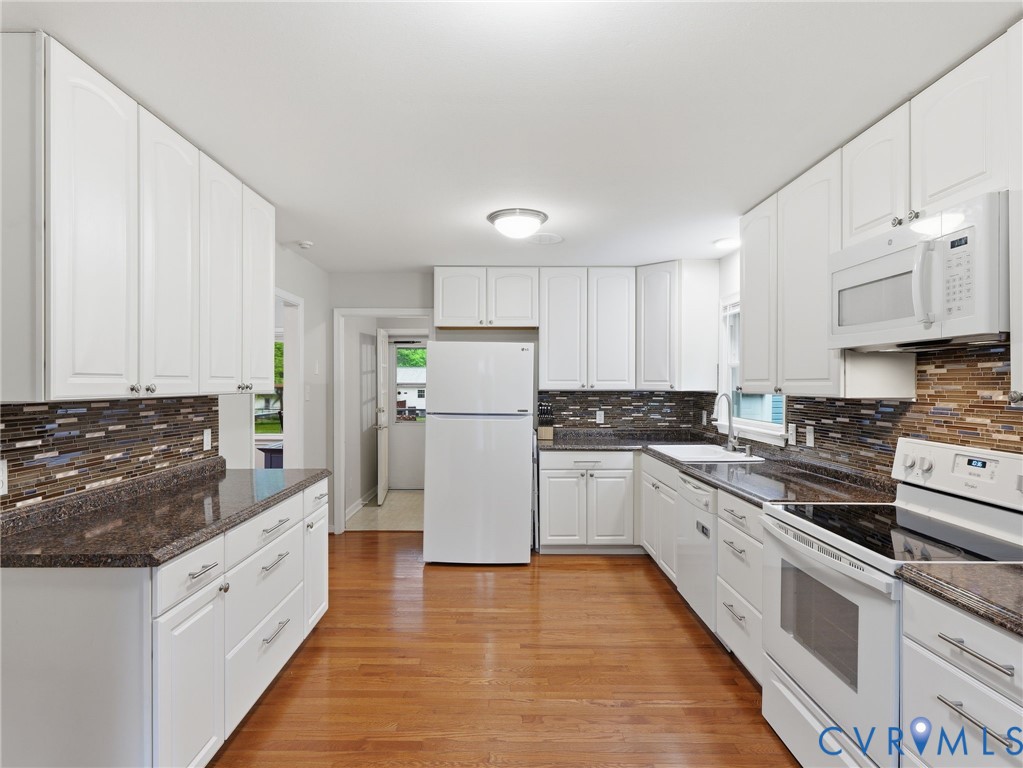 7707 Woodbrook Road Quinton, VA 23141 - Photo 7 of 42 Kitchen featuring white cabinetry, dark speckled c