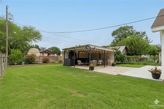 a view of a dining room with furniture wooden floor and chandelier
