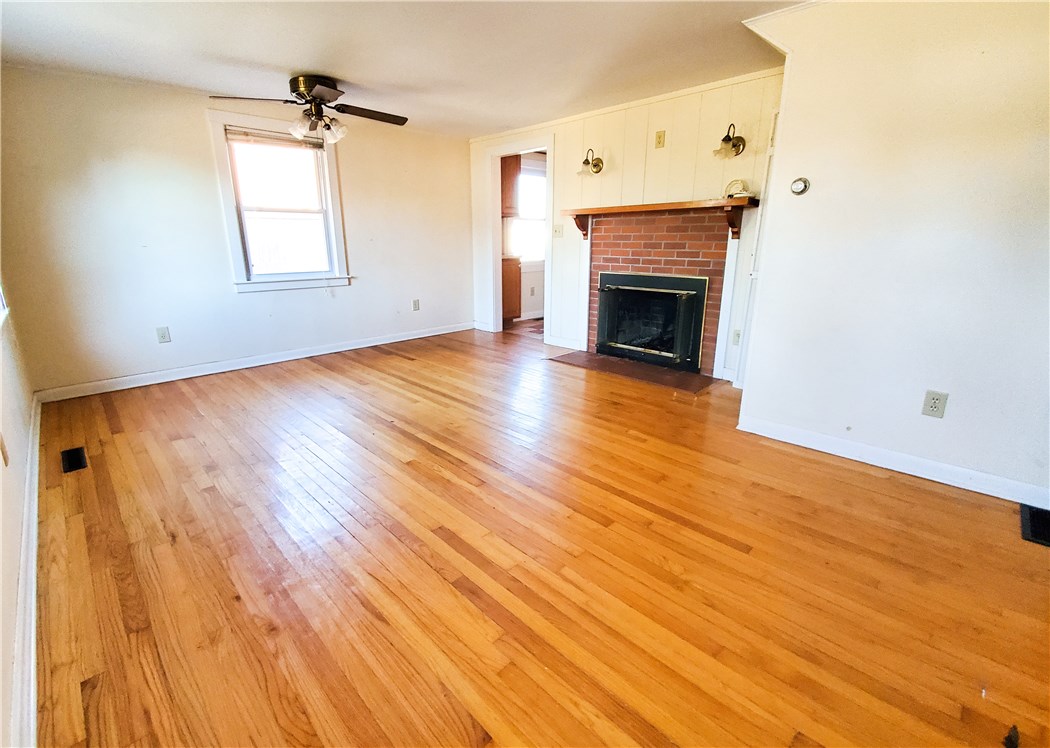 47 Salt Pond Way Westerly, RI 02891 - Photo 8 of 39 Living room with fireplace and hardwood floors