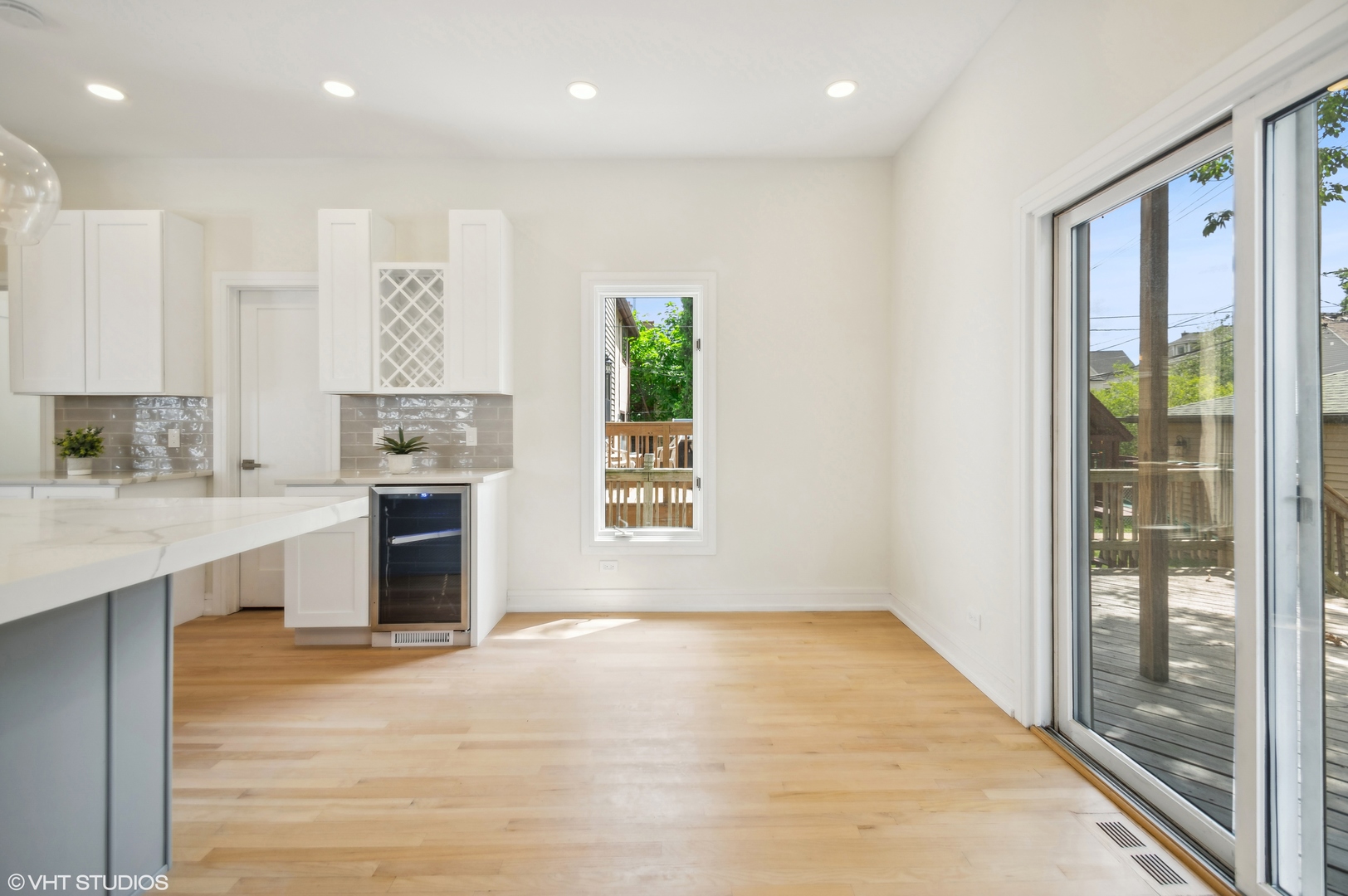 4110 North Kenneth Avenue Chicago, IL 60641 - Photo 11 of 28 a large white kitchen with granite countertop a stove a sink and a refrigerator