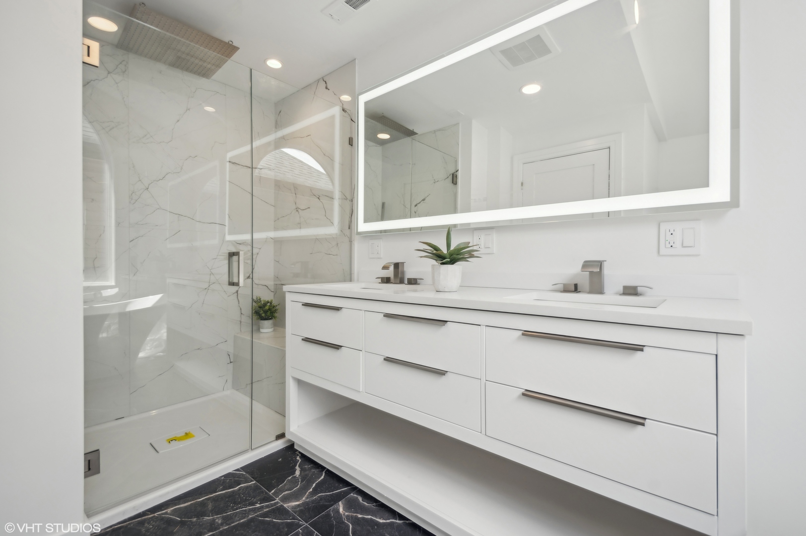 4110 North Kenneth Avenue Chicago, IL 60641 - Photo 13 of 28 a bathroom with a shower sink and mirror