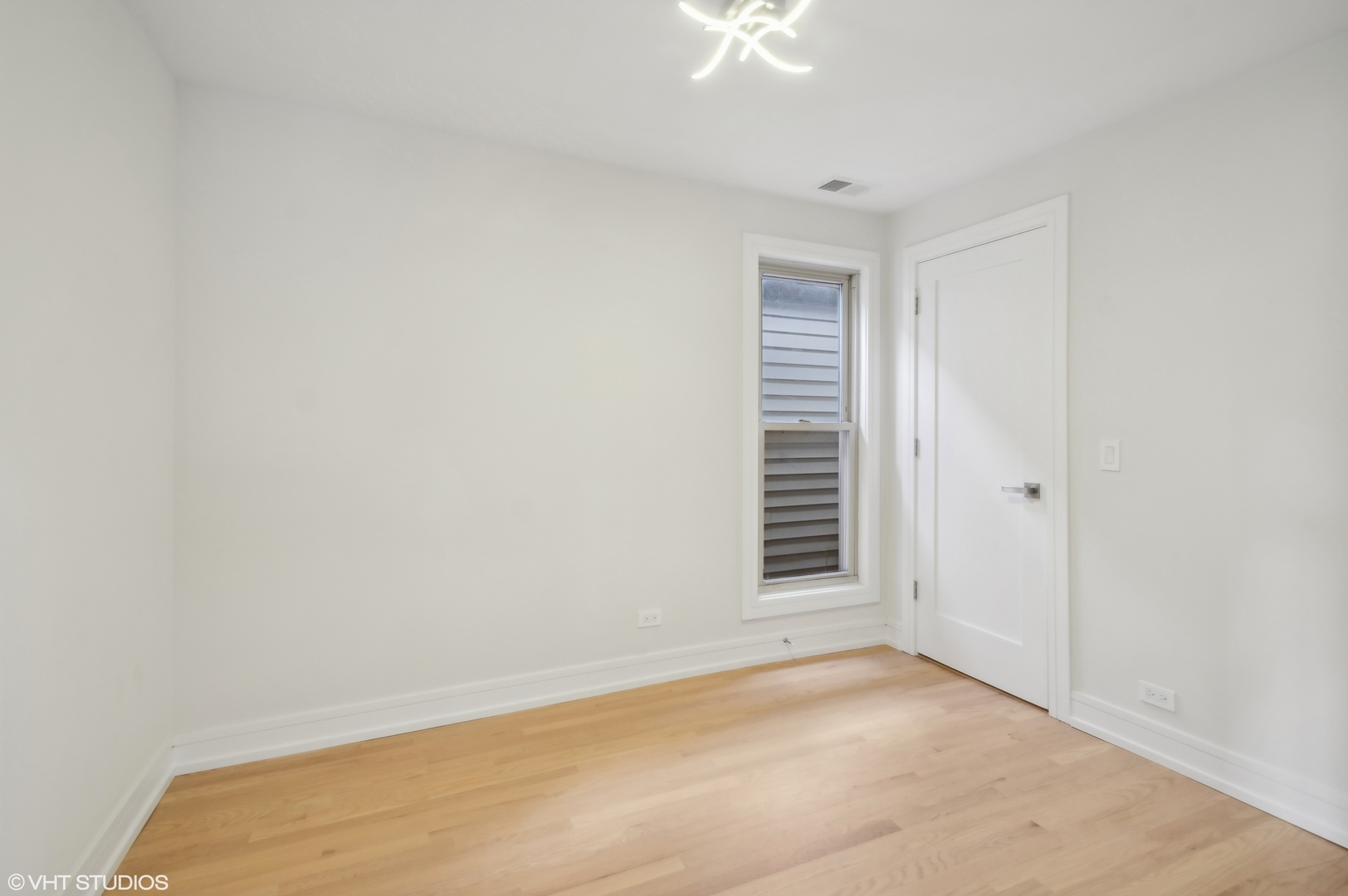 4110 North Kenneth Avenue Chicago, IL 60641 - Photo 19 of 28 a view of an empty room with a window