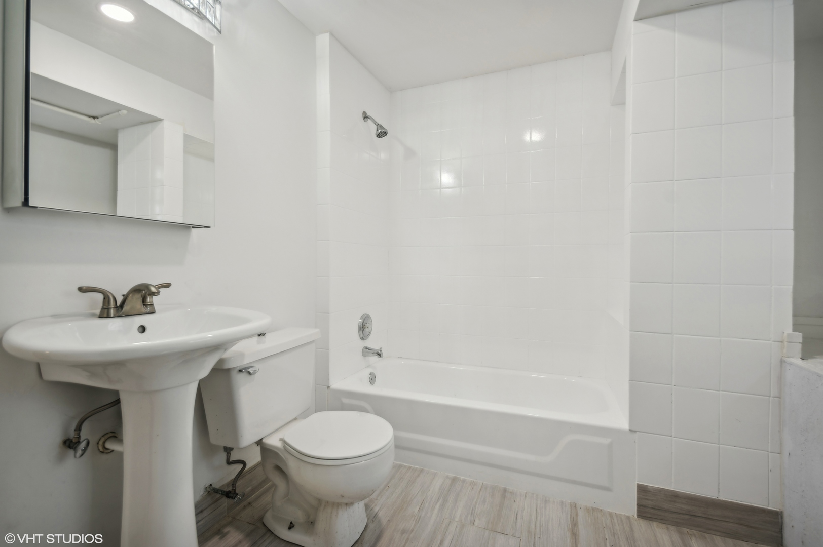 4110 North Kenneth Avenue Chicago, IL 60641 - Photo 21 of 28 a bathroom with a sink toilet and shower