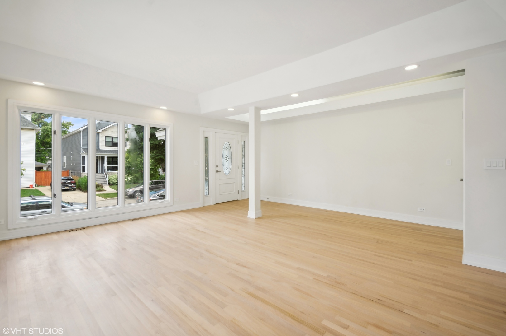 4110 North Kenneth Avenue Chicago, IL 60641 - Photo 3 of 28 an empty room with wooden floor and windows