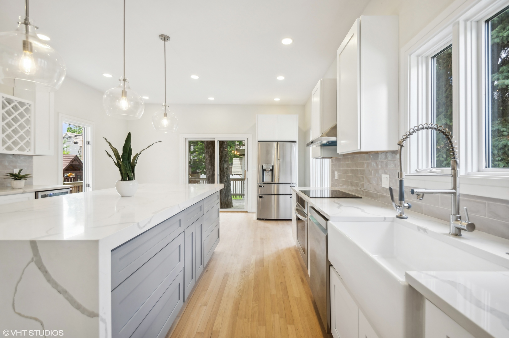 4110 North Kenneth Avenue Chicago, IL 60641 - Photo 9 of 28 a kitchen with kitchen island granite countertop a sink a counter top space appliances and cabinets