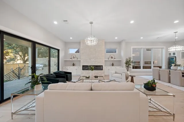 a large white bathroom with a double vanity sink mirror and shower