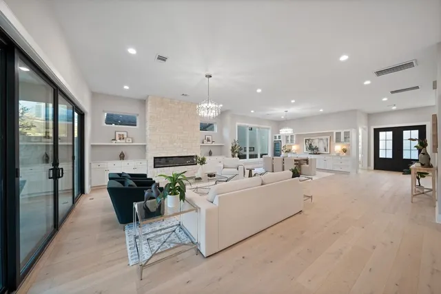 a spacious bathroom with a double vanity sink mirror and bathtub