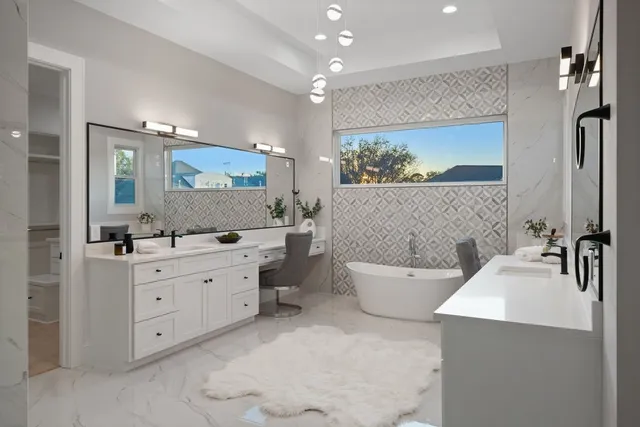 a bathroom with a shower sink vanity and mirror