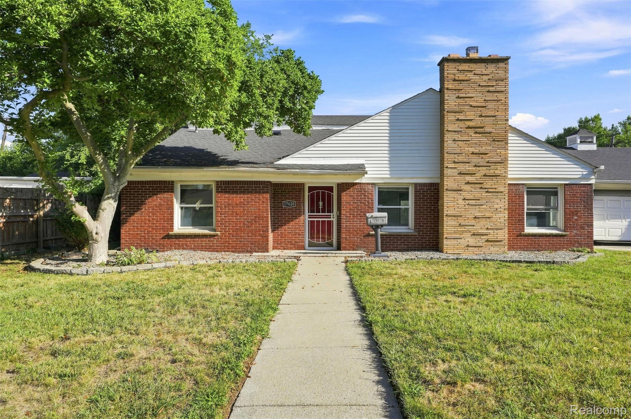17620 Cornell Road Southfield, MI 48075 - Photo 3 of 29 Brick exterior with white siding accents and a contrasting stone chimney