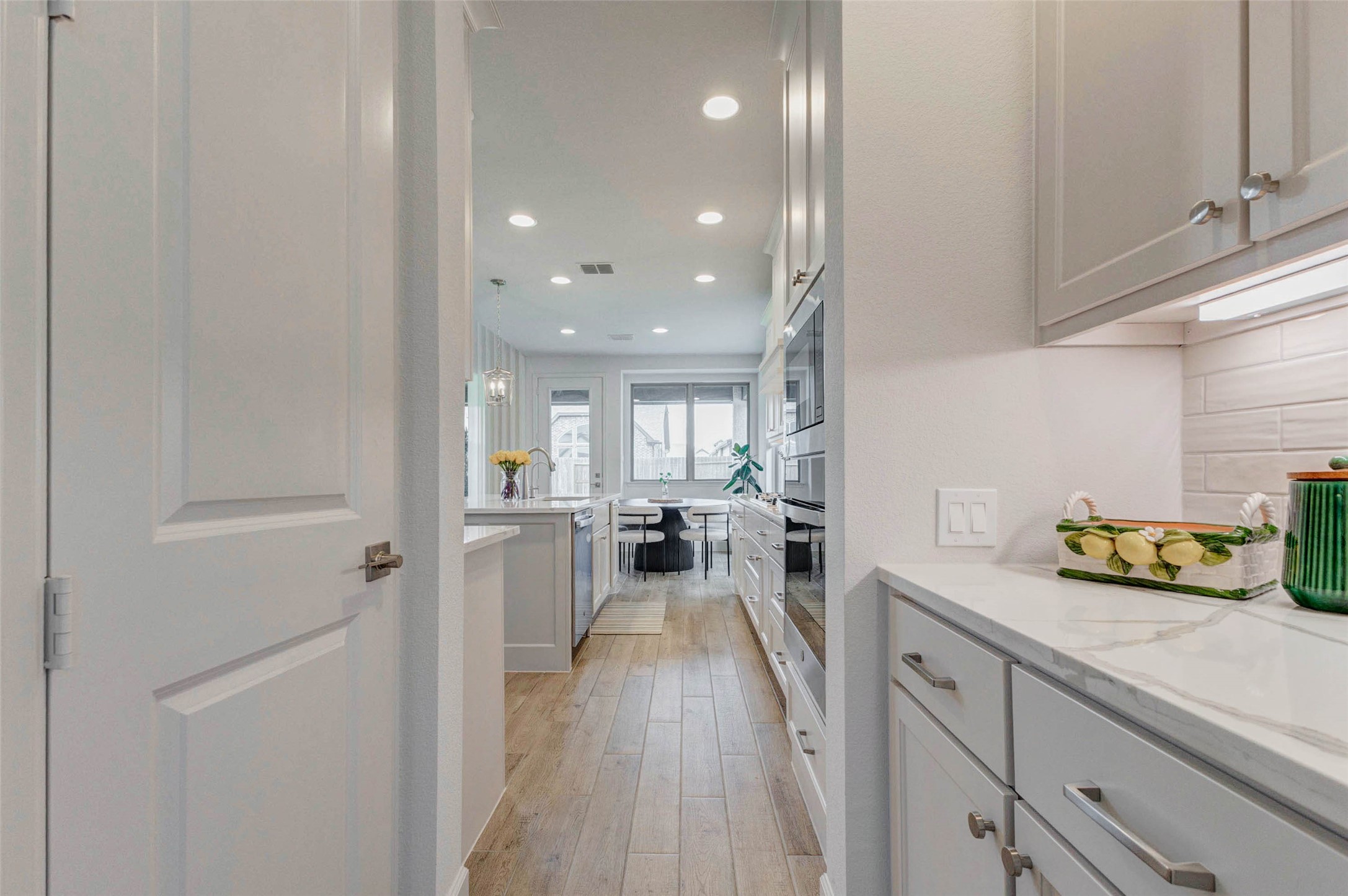 4322 Southpoint Way Fulshear, TX 77441 - Photo 12 of 50 Butler pantry with sleek cabinetry, stainless steel appliances, and a bright, airy atmosphere. Walk in pantry with plenty of storage space.