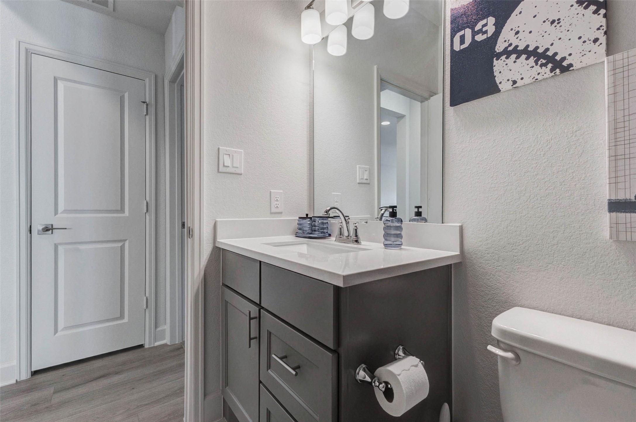 4322 Southpoint Way Fulshear, TX 77441 - Photo 42 of 50 Modern bathroom with a sleek vanity featuring ample storage, a stylish mirror with overhead lighting, and a neutral color palette. Perfect for a contemporary home.