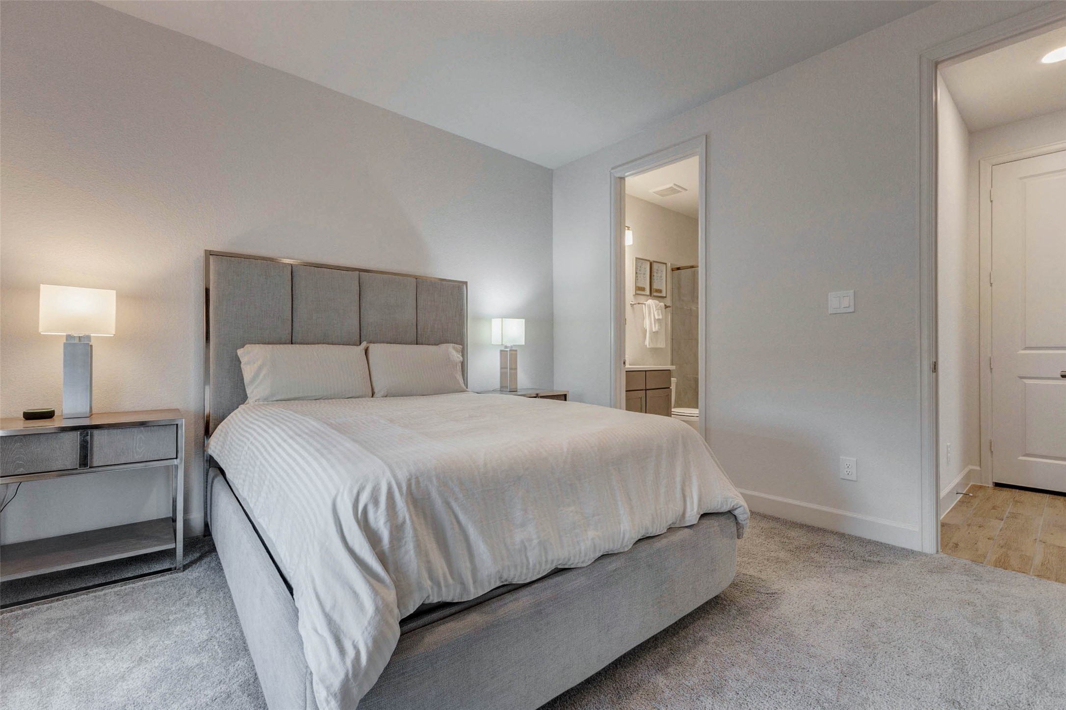 4322 Southpoint Way Fulshear, TX 77441 - Photo 7 of 50 Cozy secondary bedroom with in suite bath located on the main floor. Neutral tones create a calming atmosphere. Ideal for guests or occupants that prefers not going up and down stairs.