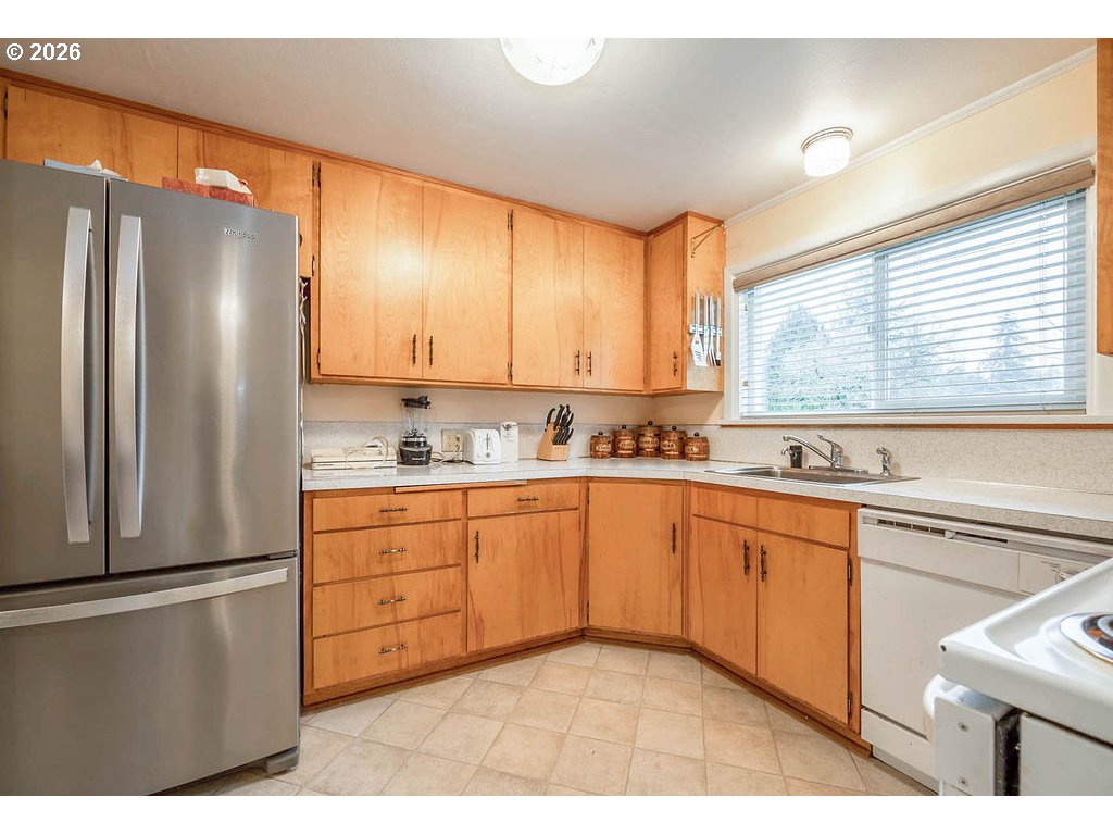 190 Hunsaker Lane Eugene, OR 97404 - Photo 14 of 28 a kitchen with stainless steel appliances granite countertop a refrigerator sink and cabinets