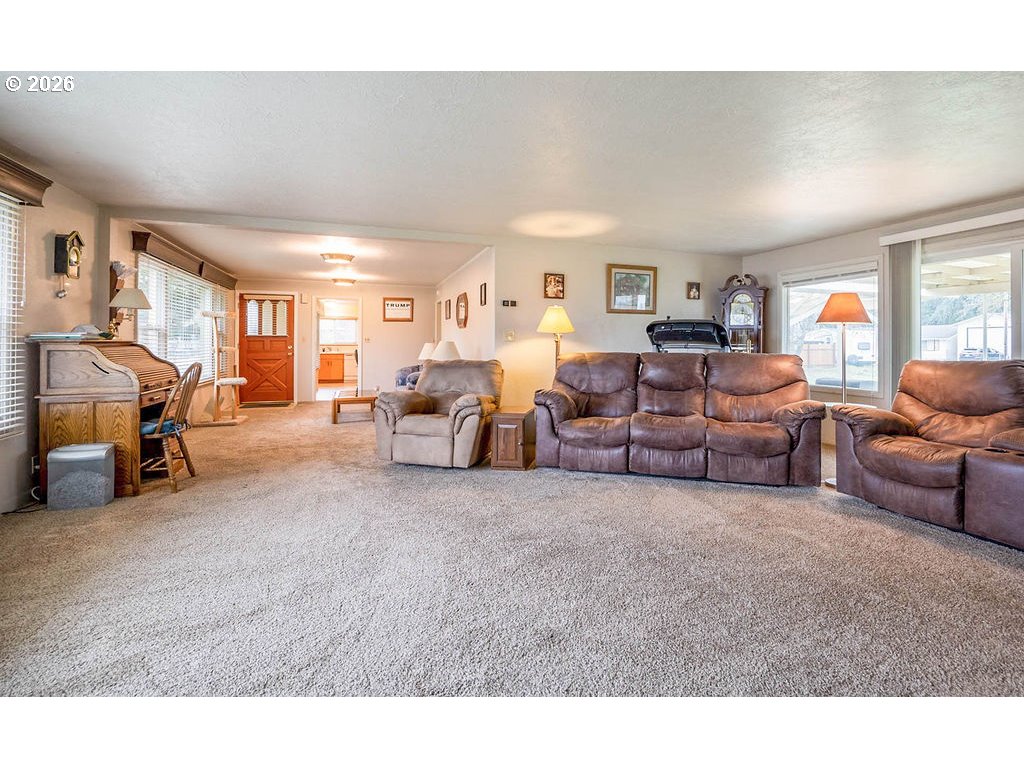190 Hunsaker Lane Eugene, OR 97404 - Photo 4 of 28 a living room with furniture and a flat screen tv