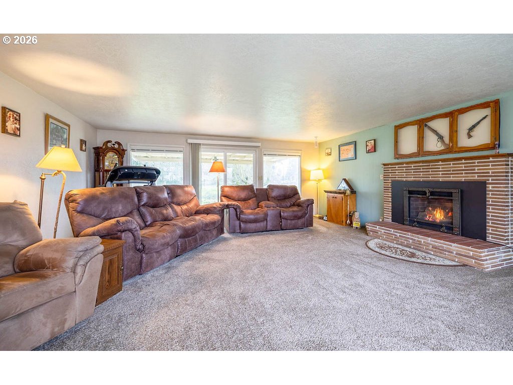 190 Hunsaker Lane Eugene, OR 97404 - Photo 5 of 28 a living room with furniture and a fireplace
