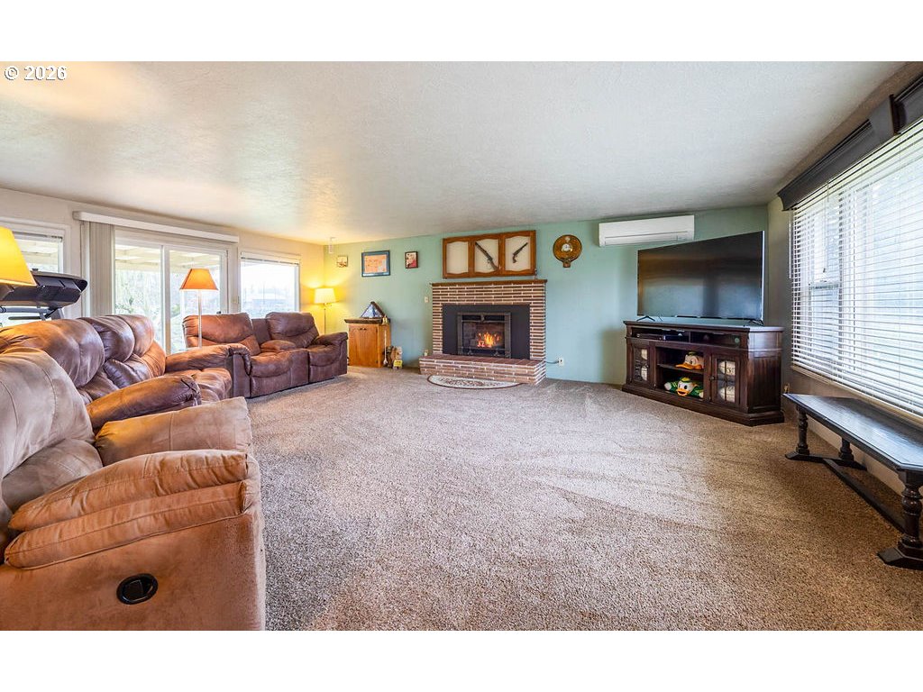 190 Hunsaker Lane Eugene, OR 97404 - Photo 6 of 28 a living room with furniture and a flat screen tv