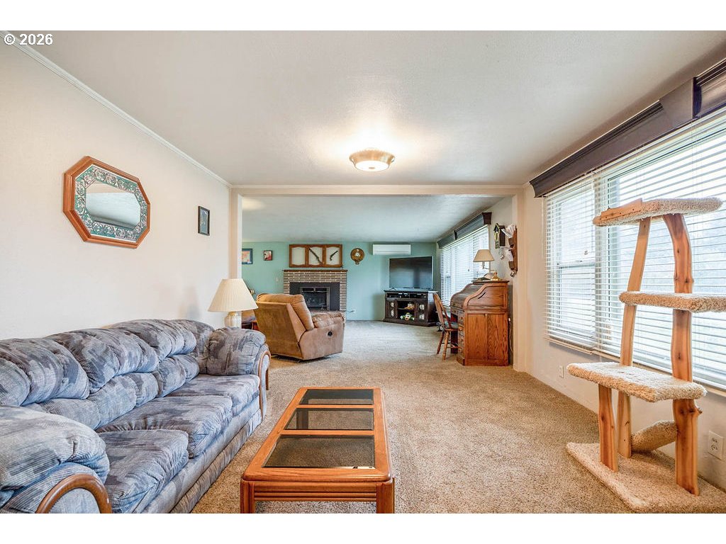 190 Hunsaker Lane Eugene, OR 97404 - Photo 9 of 28 a living room with furniture and a large window