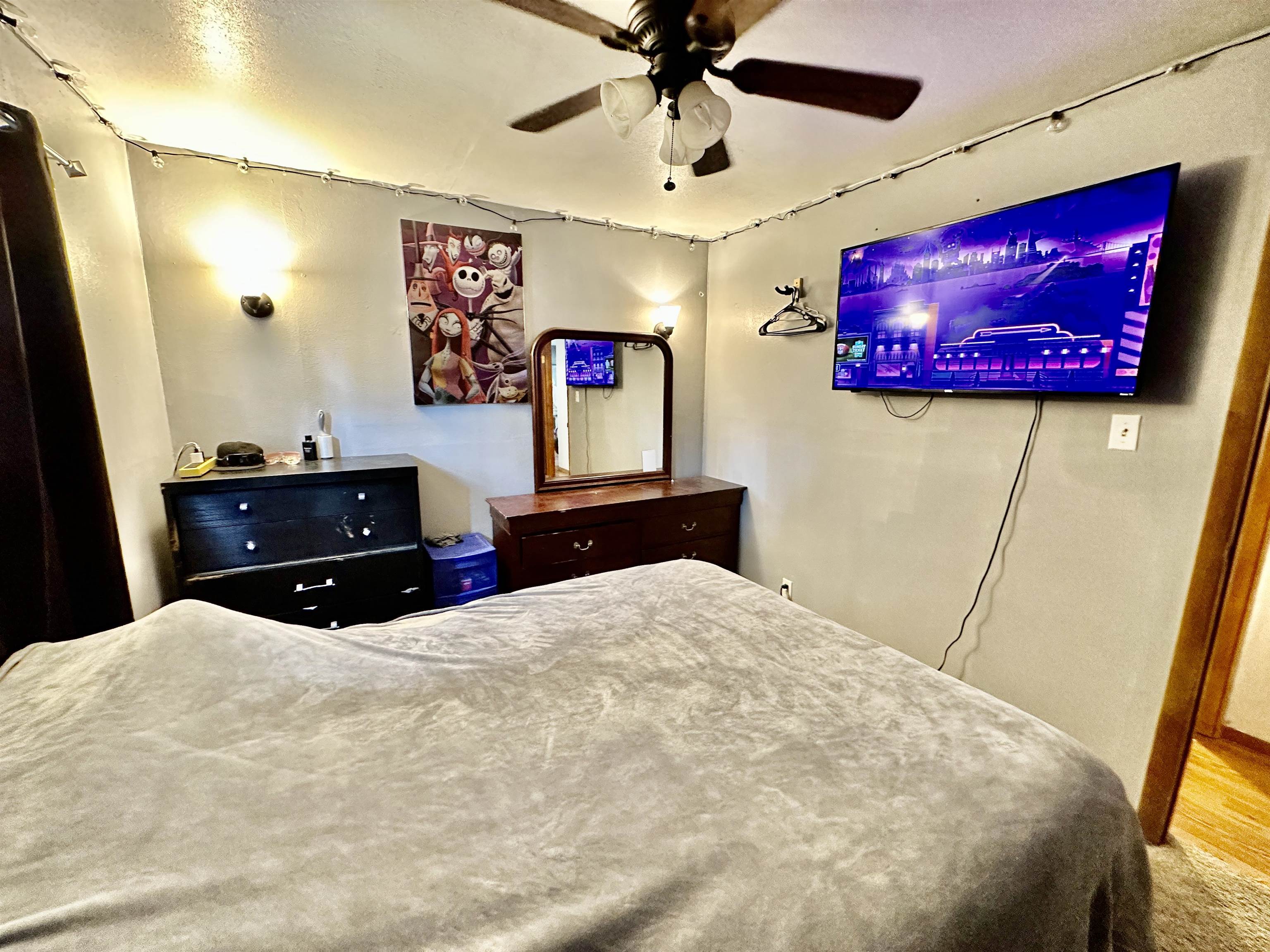 7611 Randy Road Machesney Park, IL 61115 - Photo 11 of 16 a bed room with a bed and a flat screen tv