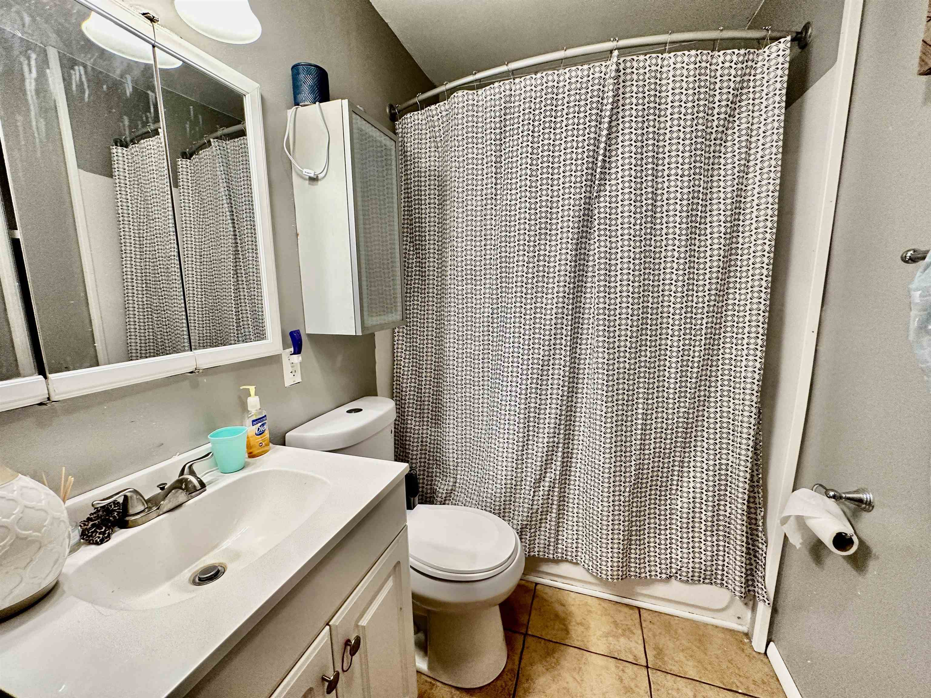 7611 Randy Road Machesney Park, IL 61115 - Photo 12 of 16 a bathroom with a sink toilet and shower