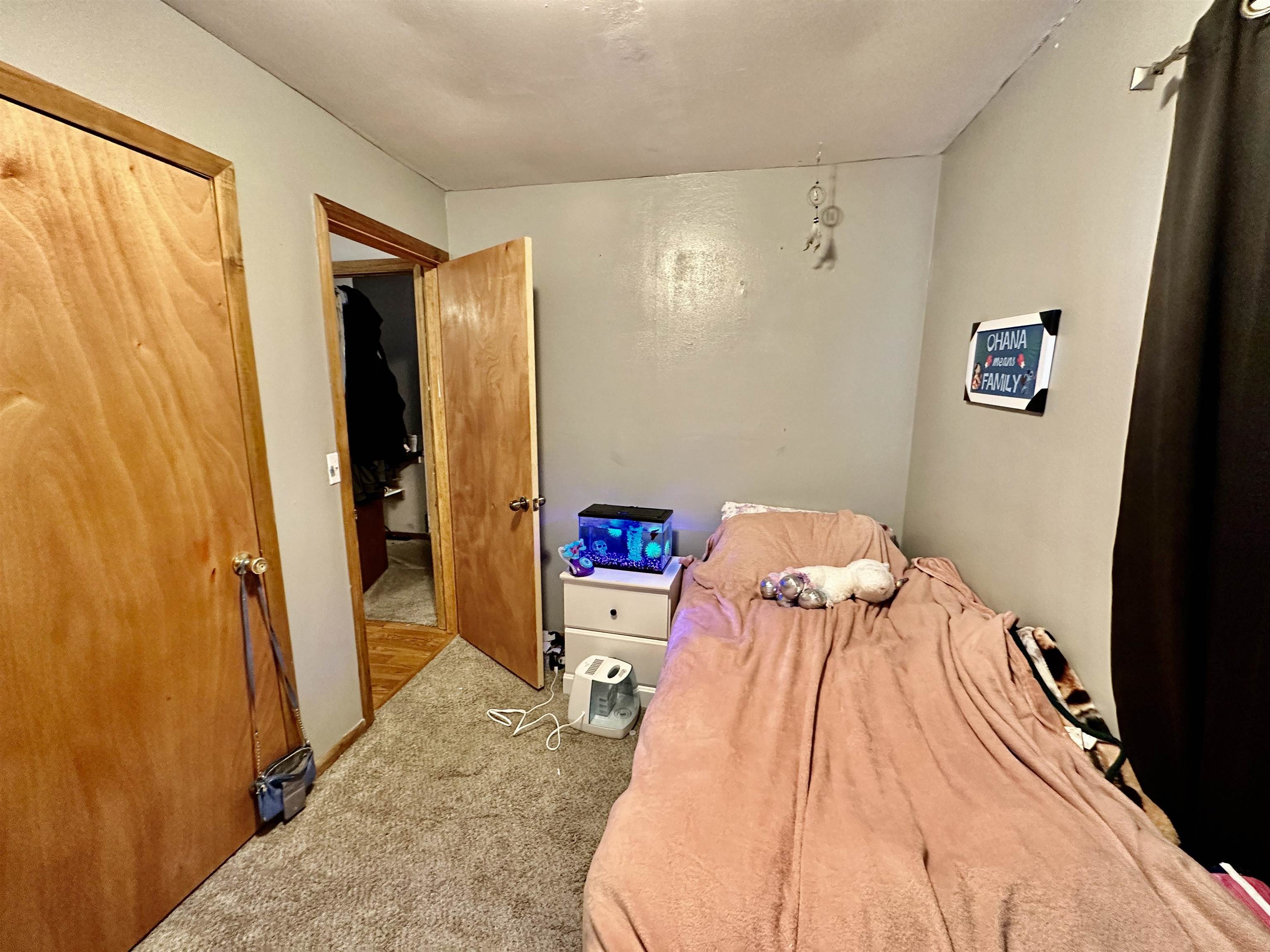 7611 Randy Road Machesney Park, IL 61115 - Photo 13 of 16 a bed room with a bed and a view of bathroom