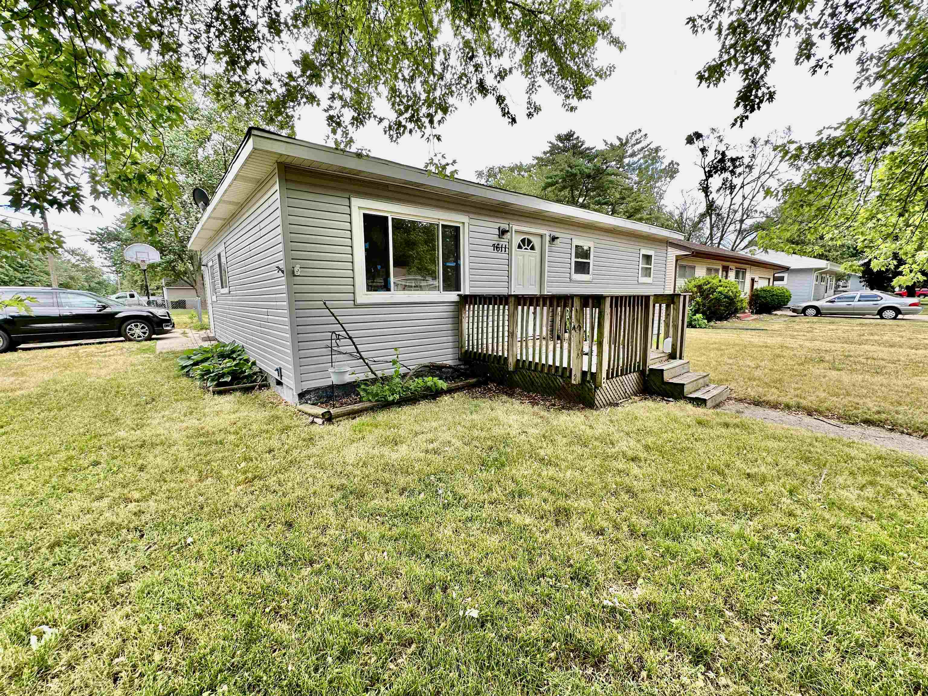 7611 Randy Road Machesney Park, IL 61115 - Photo 2 of 16 a view of a house with a yard