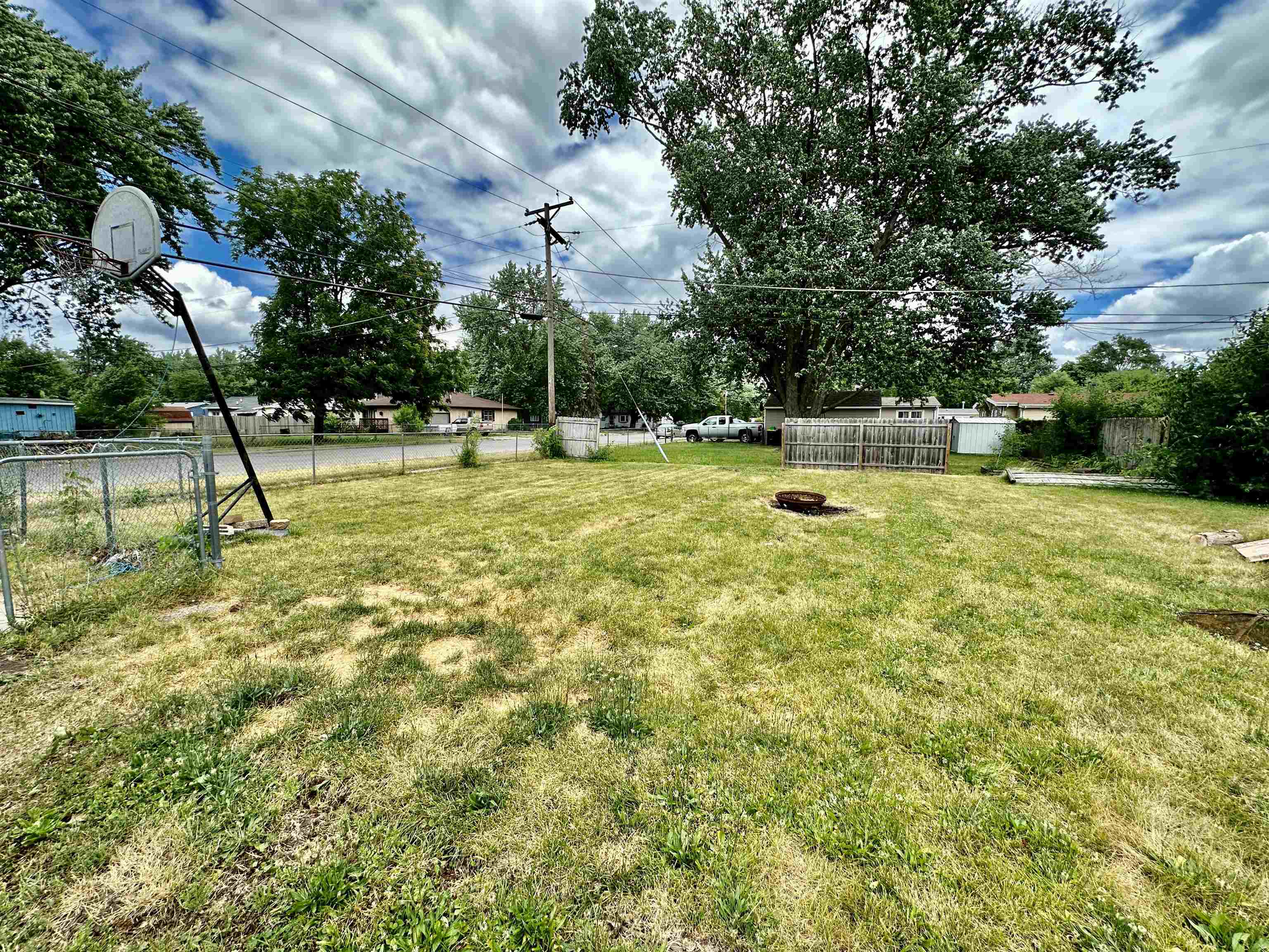 7611 Randy Road Machesney Park, IL 61115 - Photo 4 of 16 a swimming pool with trees in the background