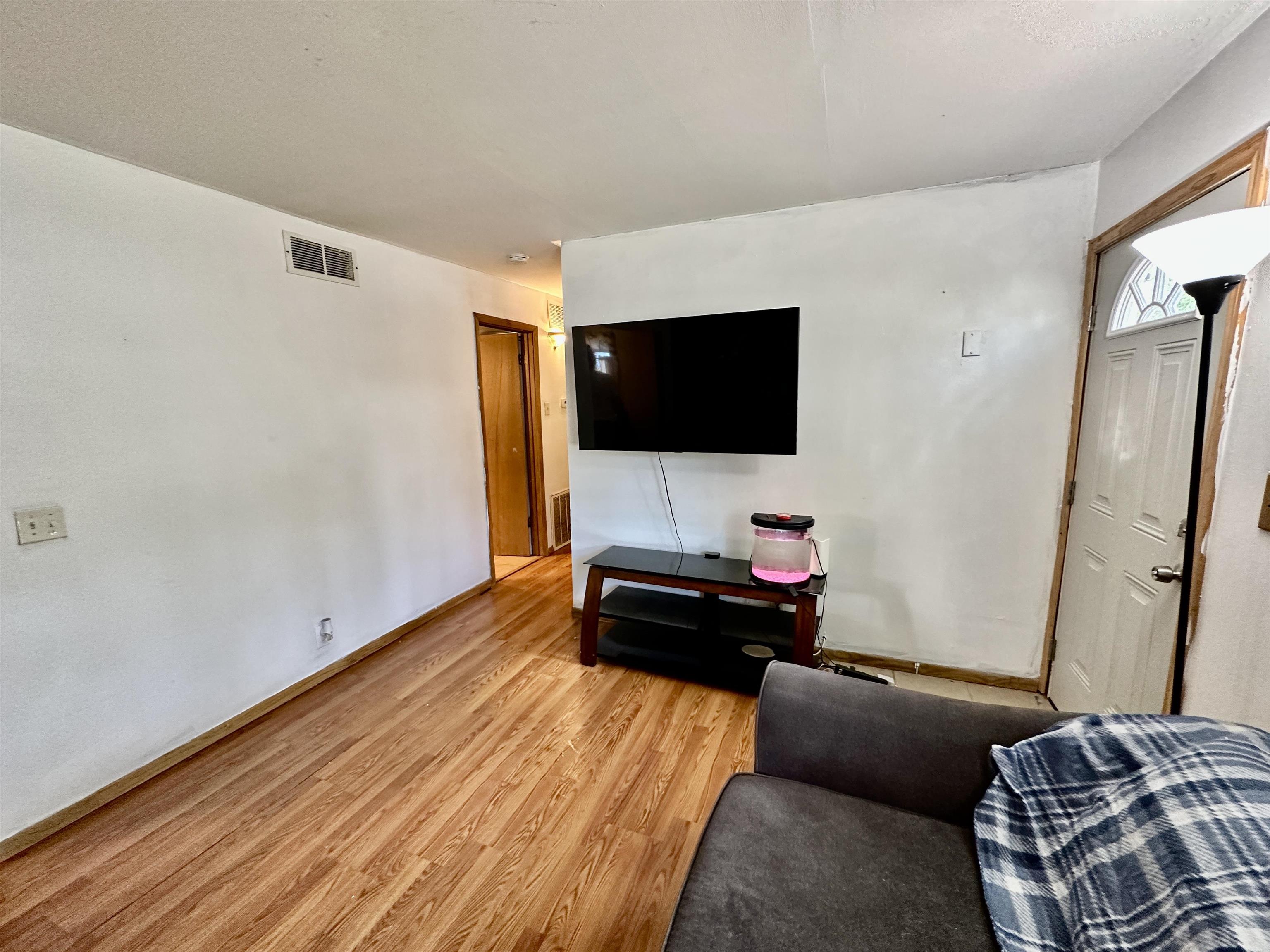 7611 Randy Road Machesney Park, IL 61115 - Photo 6 of 16 a living room with furniture and a flat screen tv