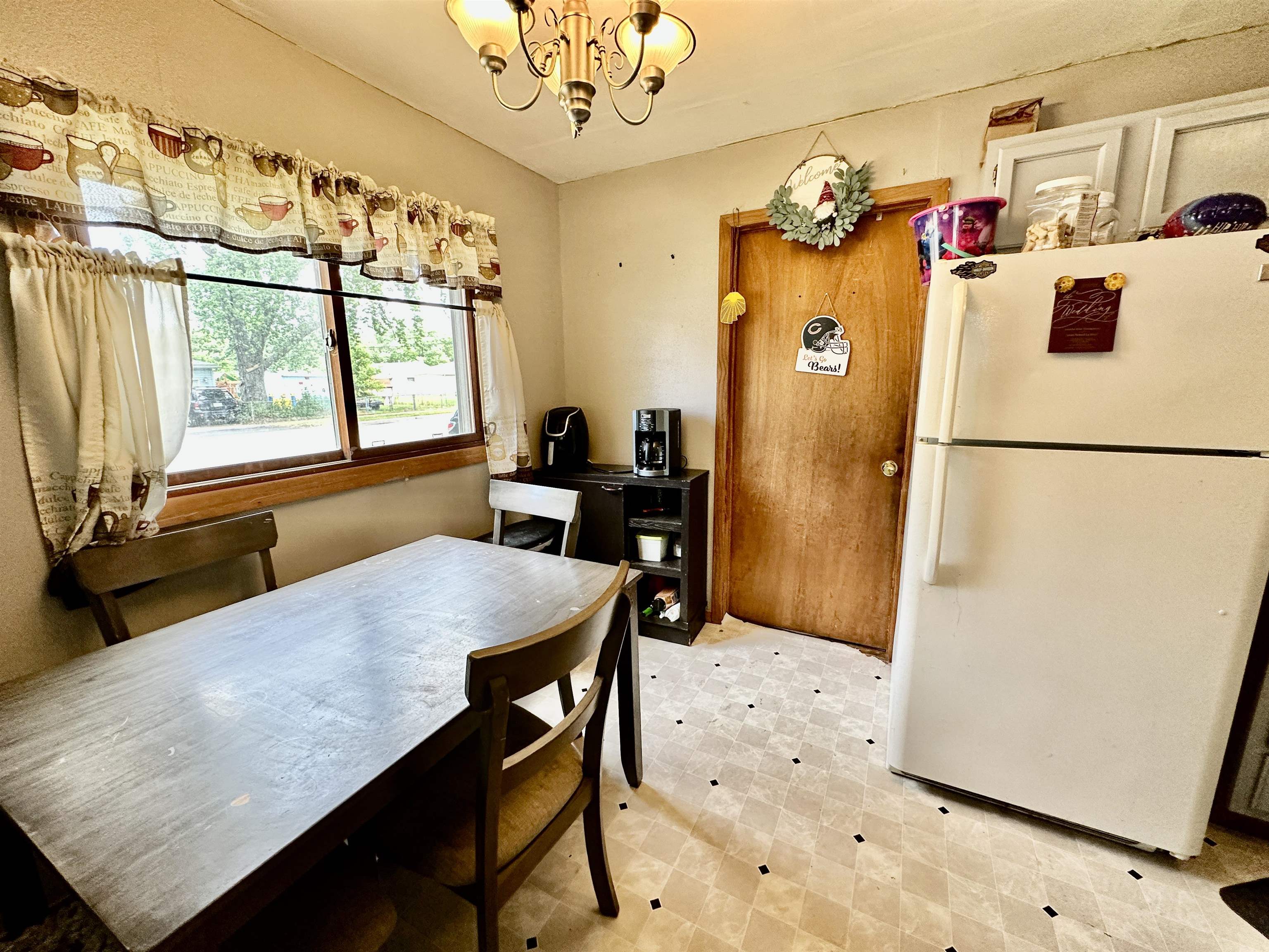7611 Randy Road Machesney Park, IL 61115 - Photo 9 of 16 a very nice looking dining room with a refrigerator