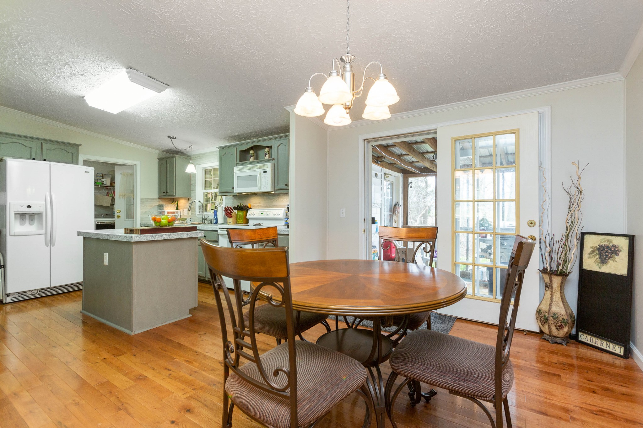 5425 Ashburn Road Springfield, TN 37172 - Photo 13 of 40 a view of a dining room with furniture window and wooden floor