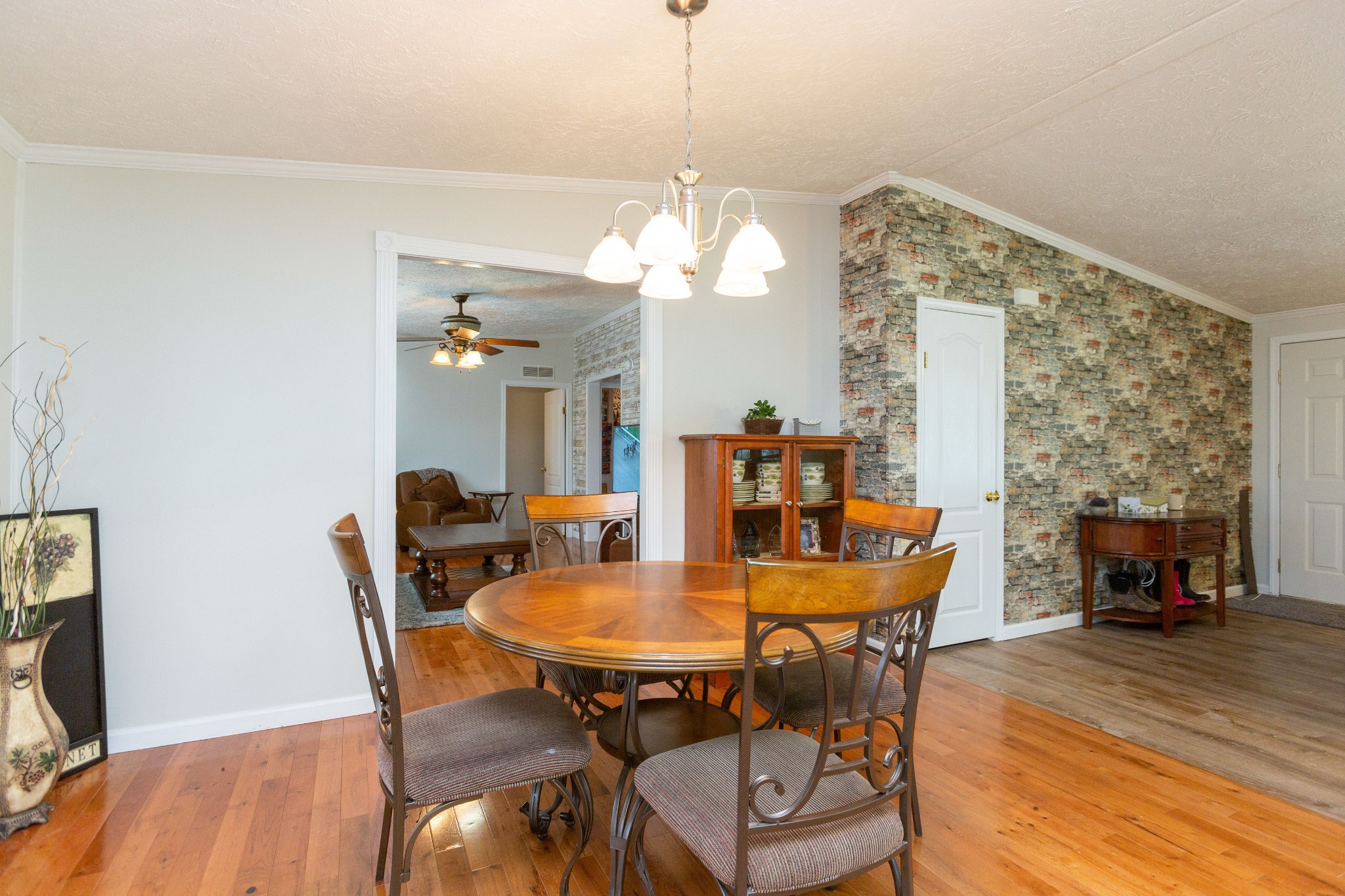 5425 Ashburn Road Springfield, TN 37172 - Photo 15 of 40 a dining room with furniture a chandelier and wooden floor