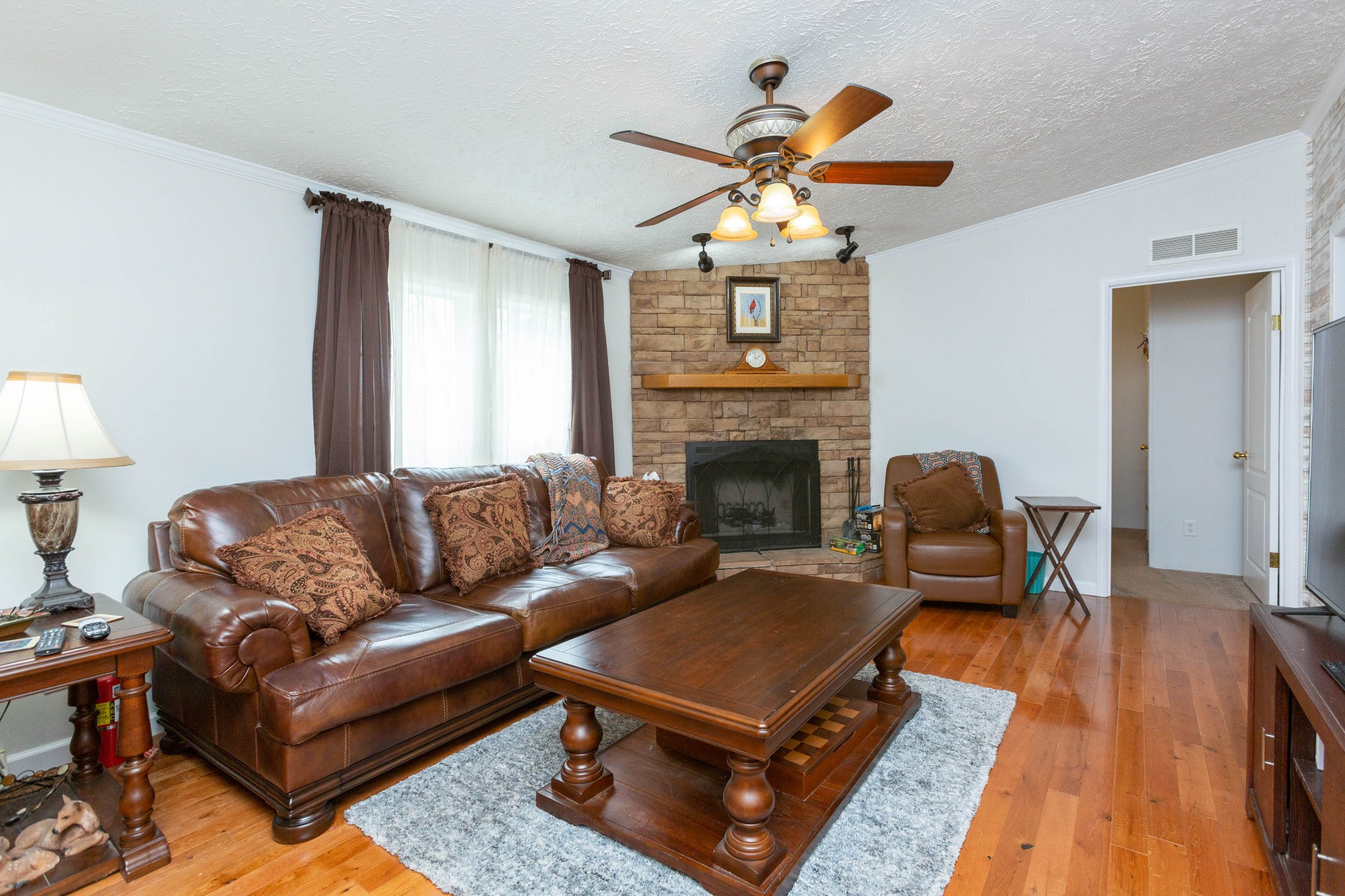 5425 Ashburn Road Springfield, TN 37172 - Photo 22 of 40 a living room with furniture and a fireplace