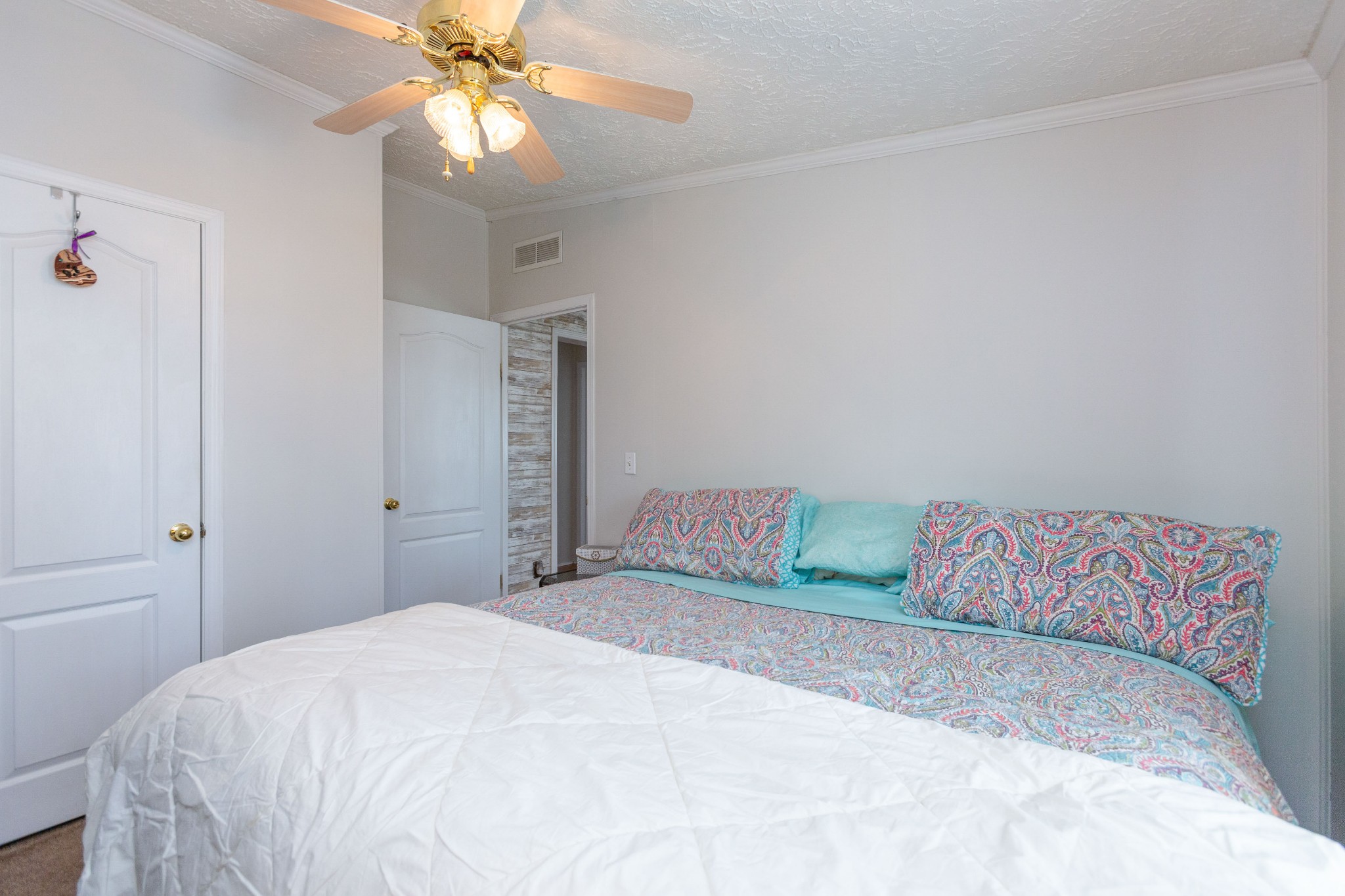 5425 Ashburn Road Springfield, TN 37172 - Photo 23 of 40 a bedroom with a bed and a chandelier