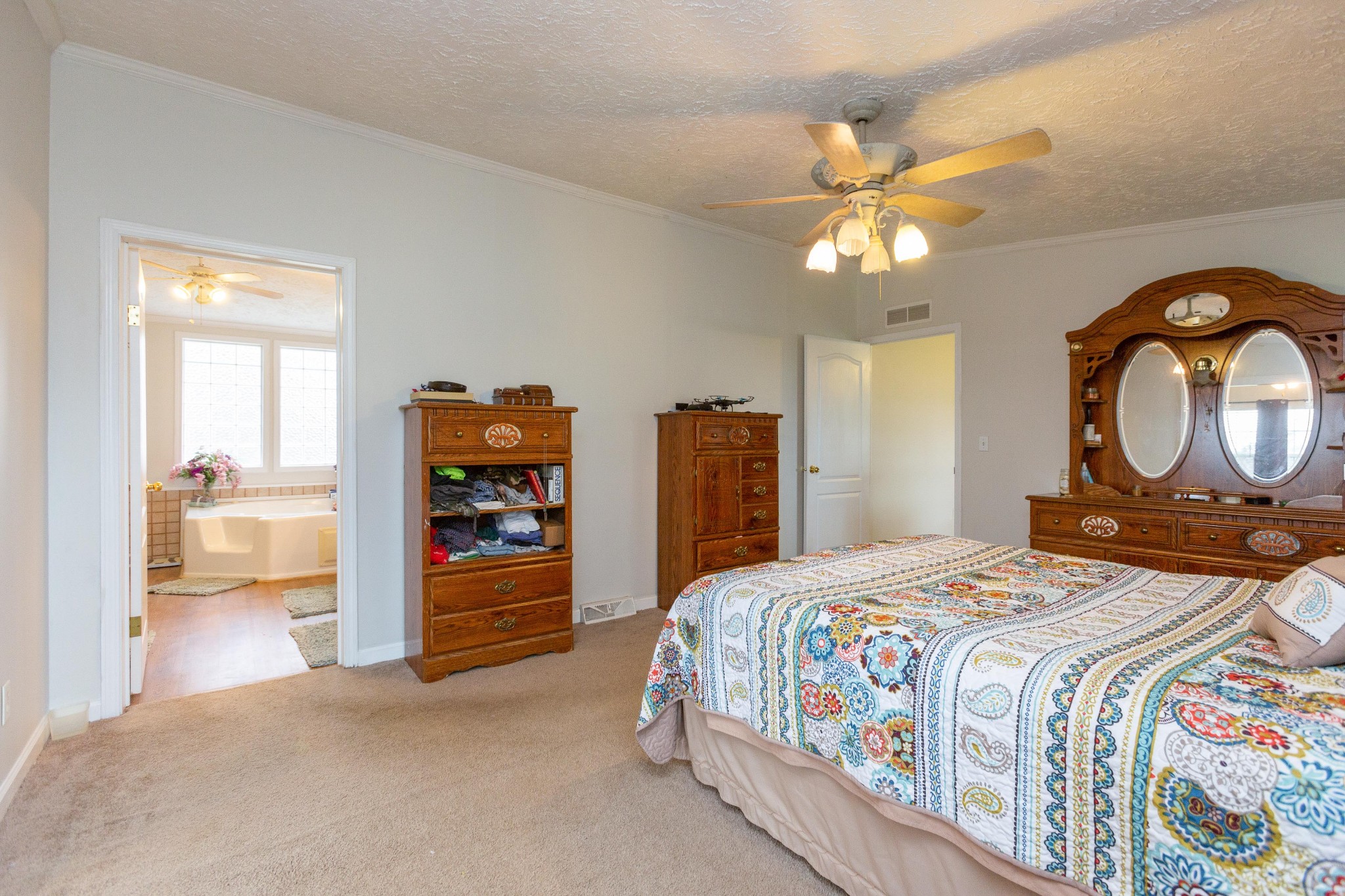 5425 Ashburn Road Springfield, TN 37172 - Photo 28 of 40 a bedroom with a bed and a chandelier