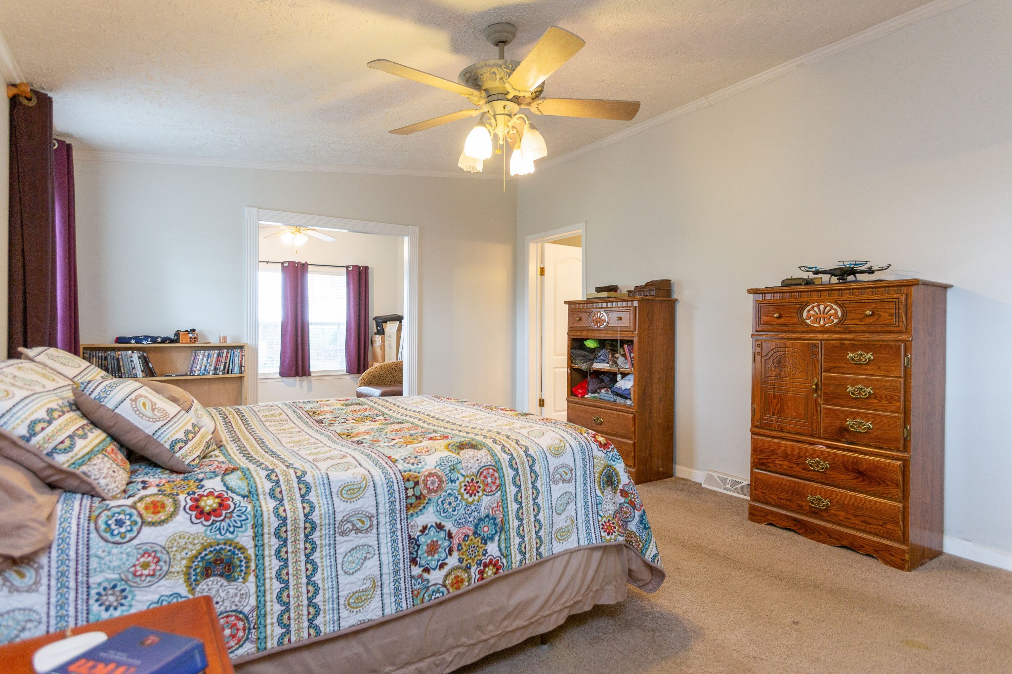 5425 Ashburn Road Springfield, TN 37172 - Photo 29 of 40 a bedroom with a bed and a chandelier