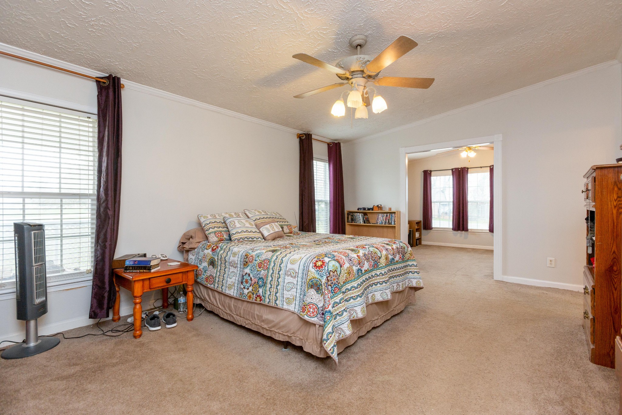 5425 Ashburn Road Springfield, TN 37172 - Photo 30 of 40 a bedroom with a bed and a chandelier